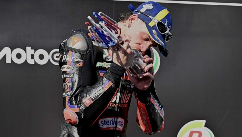 MotoGP winner Italy's rider Marco Bezzecchi celebrates on the podium after the MotoGP at the Chang International Circuit in Buriram, Thailand, Sunday, March 1, 2026. (AP Photo/Kittinun Rodsupan)