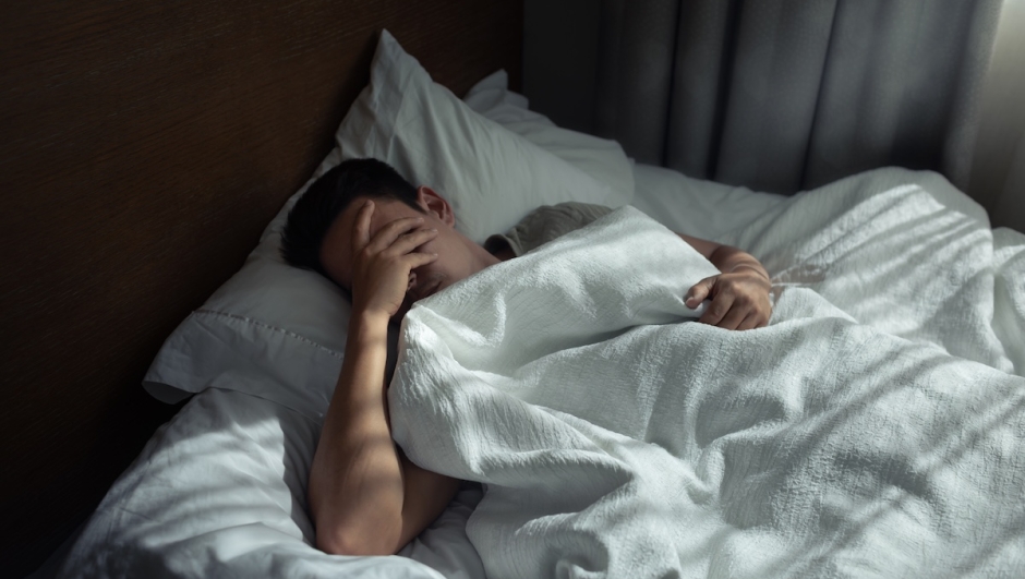 Sad lonely tired man home alone.