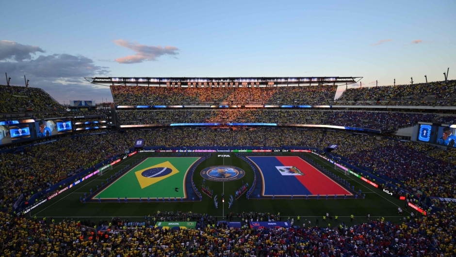 Brazilian and Haitian flags are displayed on the pitch ahead of the 2026 World Cup Group C football match between Brazil and Haiti at the Philadelphia Stadium in Philadelphia on June 19, 2026.  (Photo by ANGELA WEISS / AFP)