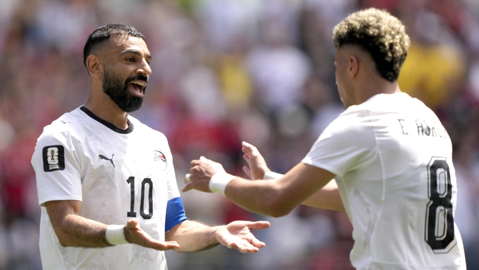 epaselect epa13039864 Emam Ashour (R) of Egypt celebrates with teammate Mohamed Salah (L) after scoring the opening goal during the FIFA World Cup 2026 group stage match Belgium against Egypt, in Seattle, USA, 15 June 2026.  EPA/STEPHEN BRASHEAR
