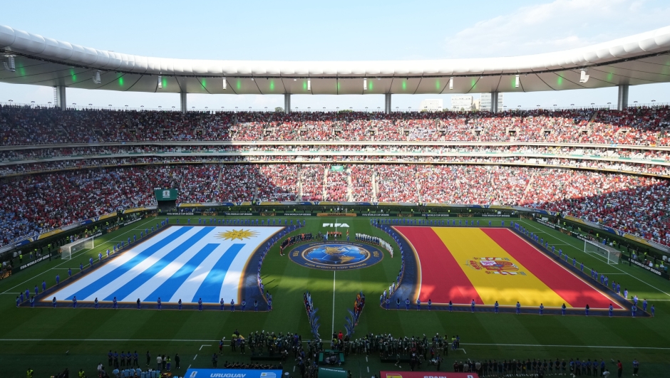 Players stand for the national anthems ahead of the World Cup Group H soccer match between Uruguay and Spain in Zapopan, near Guadalajara, Mexico, Friday, June 26, 2026. (AP Photo/Fernando Llano)