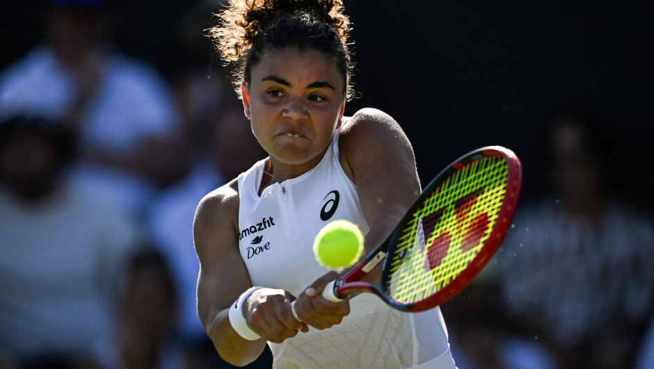 Italy's Jasmine Paolini plays a backhand return to Latvia's Anastasija Sevastova during their women's singles first round tennis match on the first day of the 2025 Wimbledon Championships at The All England Lawn Tennis and Croquet Club in Wimbledon, southwest London, on June 30, 2025. (Photo by Kirill KUDRYAVTSEV / AFP) / RESTRICTED TO EDITORIAL USE