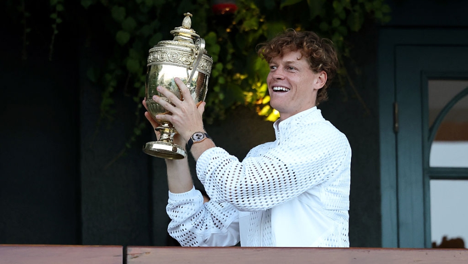  Jannik Sinner of Italy shows The Gentlemen's Singles Trophy to spectators from a balcony of Centre Court after victory against Alexander Zverev of Germany in the Gentlemen's Singles final on day fourteen of The Championships Wimbledon 2026 at All England Lawn Tennis and Croquet Club on July 12, 2026 in London, England. (Photo by Cameron Spencer/Getty Images)