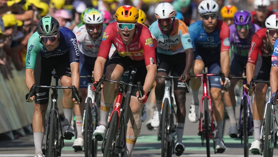 Norway's Soren Waerenskjold, center left, crosses the finish line to win the eleventh stage of the Tour de France cycling race with start in Vichy and finish in Nevers, France, Wednesday, July 15, 2026. (AP Photo/Thibault Camus) 



Associated Press / LaPresse
Only italy and spain