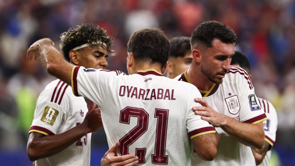 Spain's forward #21 Mikel Oyarzabal celebrates scoring his team's first goal with teammates forward #19 Lamine Yamal (L) and defender #14 Aymeric Laporte (R) during the 2026 World Cup football tournament semi-final match between France and Spain at the Dallas Stadium in Arlington on July 14, 2026.  (Photo by FRANCK FIFE / AFP)