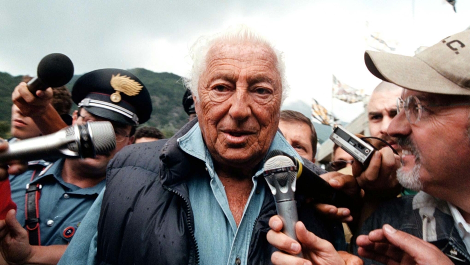 Giovanni Agnelli answers to journalists' questions as he arrives at Villar Perosa, near Turin, Tuesday, August 18, 1998, to watch a Juventus training match. Agnelli said today that Juventus players have nothing to with doping. (AP Photo/Mauro Pilone)