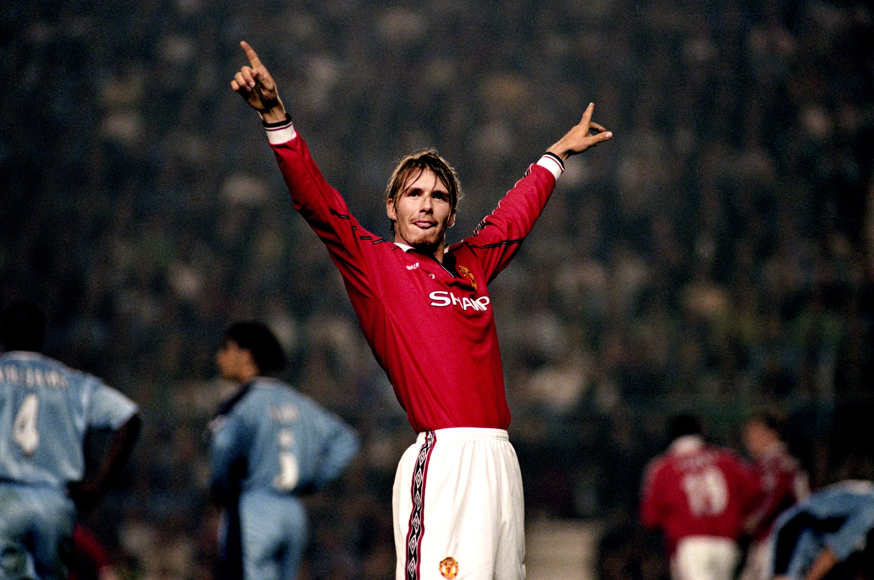 Manchester United's David Beckham celebrates their first goal.  (Photo by Steve Mitchell/EMPICS via Getty Images)