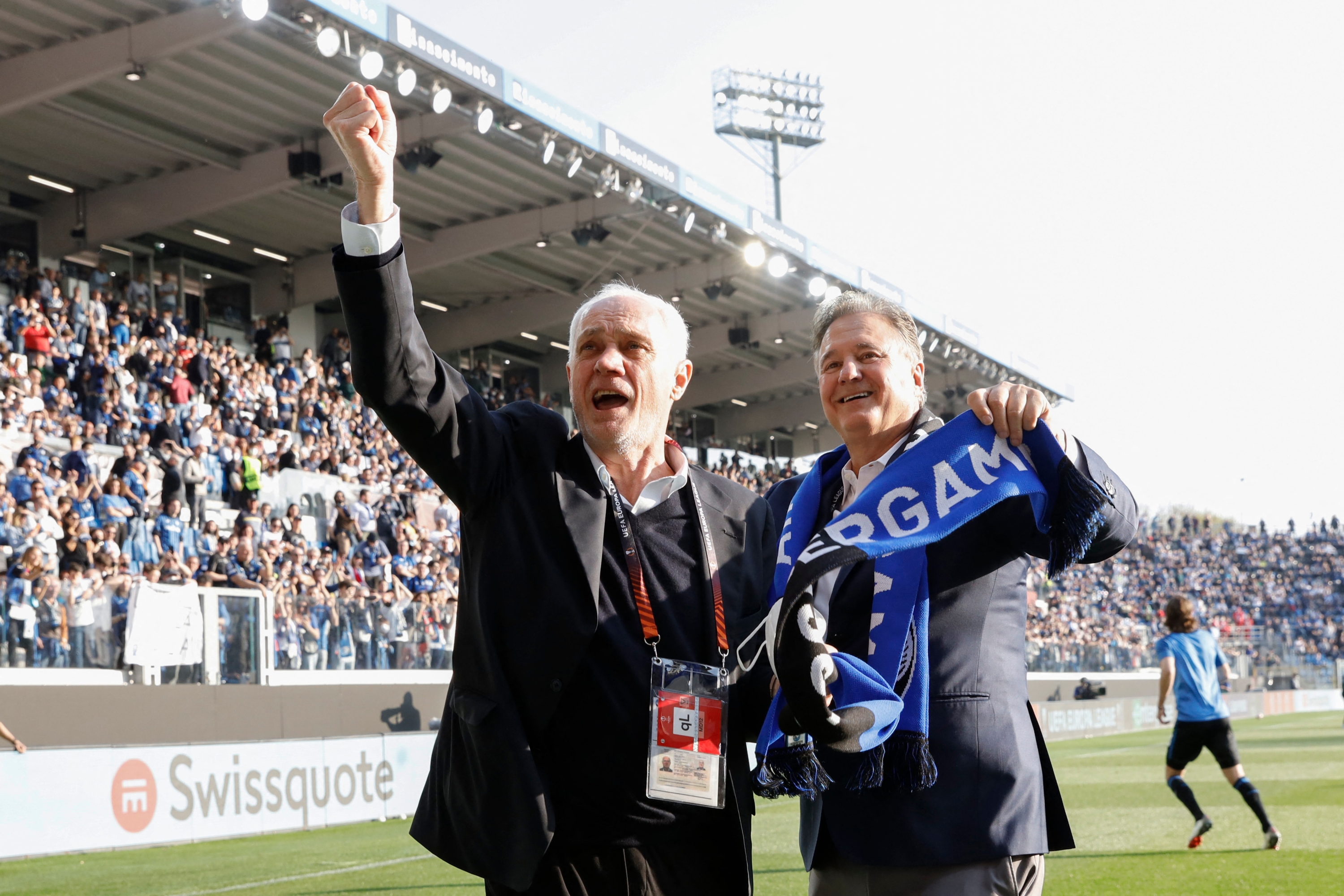 Antonio Percassi and Steve Pagliuca hold up a Atalanta BC scarf during the football Europa League match Atalanta BC vs RB Lipsia on April 14, 2022 at the Gewiss Stadium in Bergamo, Italy (Photo by Francesco Scaccianoce/LiveMedia/NurPhoto) (Photo by Francesco Scaccianoce / NurPhoto / NurPhoto via AFP)