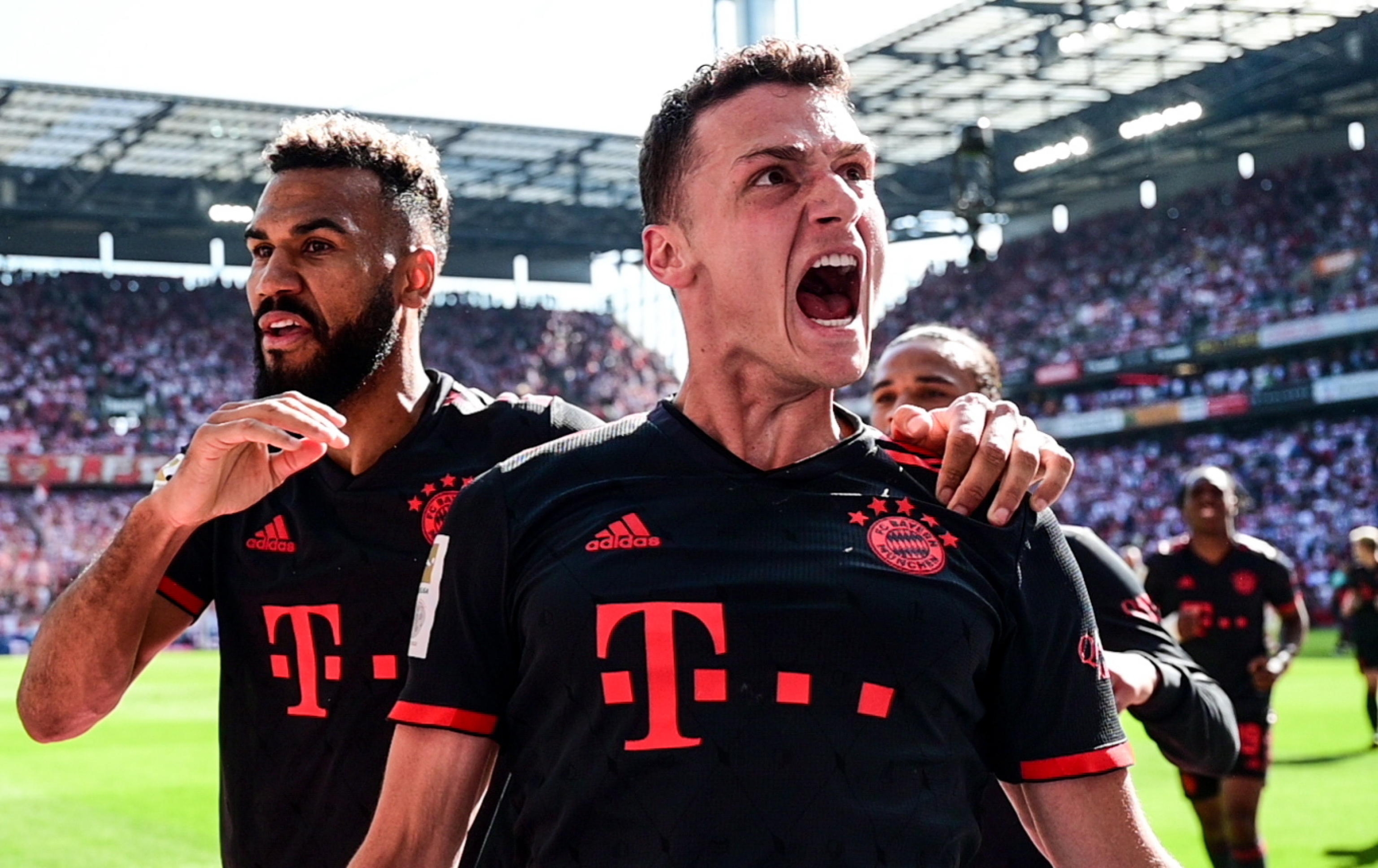 epa10659551 Bayern Munich's Benjamin Pavard (R) and Eric Maxim Choupo-Moting celebrate after winning the German Bundesliga soccer match between 1.FC Cologne and FC Bayern Munich, in Cologne, Germany, 27 May 2023. Both Bayern Munich and Borussia Dortmund finished the season on 71 points but Bayern won the title due to a better goal difference.  EPA/Filip Singer CONDITIONS - ATTENTION:  The DFL regulations prohibit any use of photographs as image sequences and/or quasi-video.