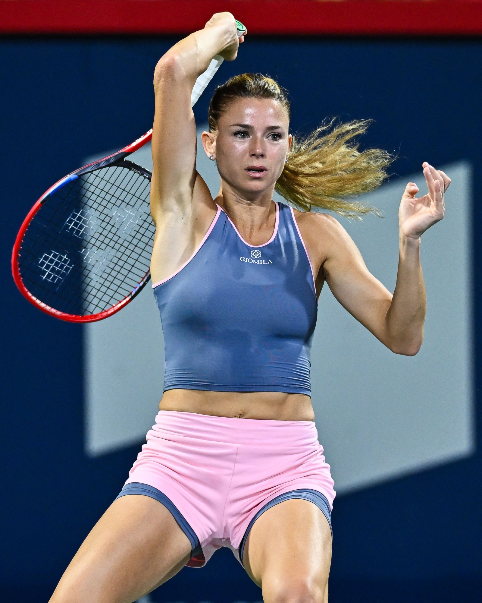 Camila Giorgi of Italy hits a return against Petra Kvitova of the Czech Republic on Day 3 during the National Bank Open at Stade IGA on August 9, 2023 in Montreal, Canada. Minas Panagiotakis/Getty Images/AFP (Photo by Minas Panagiotakis / GETTY IMAGES NORTH AMERICA / Getty Images via AFP)