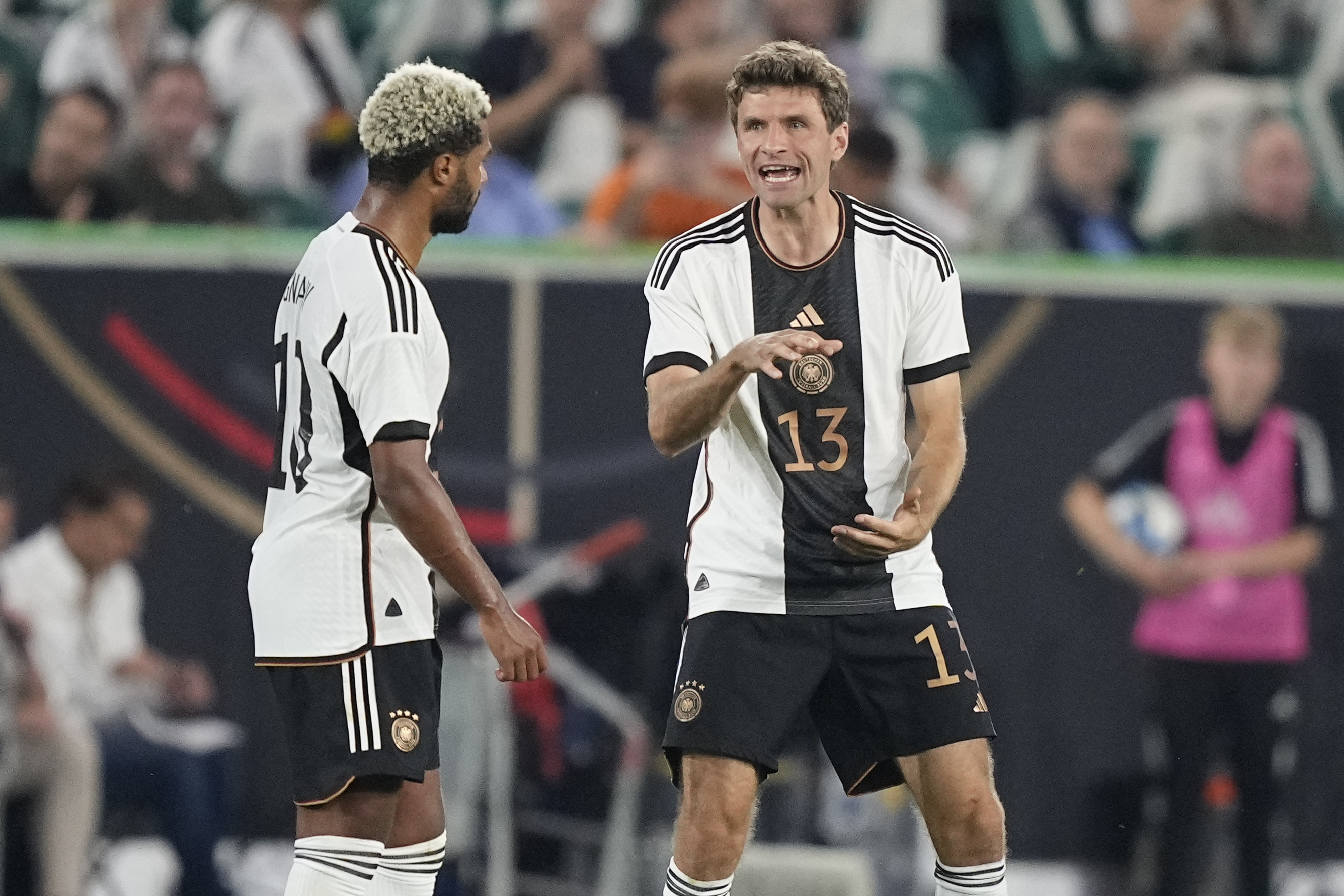 Germany's Thomas Muller, right, gestures during an international friendly soccer match between Germany and Japan in Wolfsburg, Germany, Saturday, Sept. 9, 2023. (AP Photo/Martin Meissner)