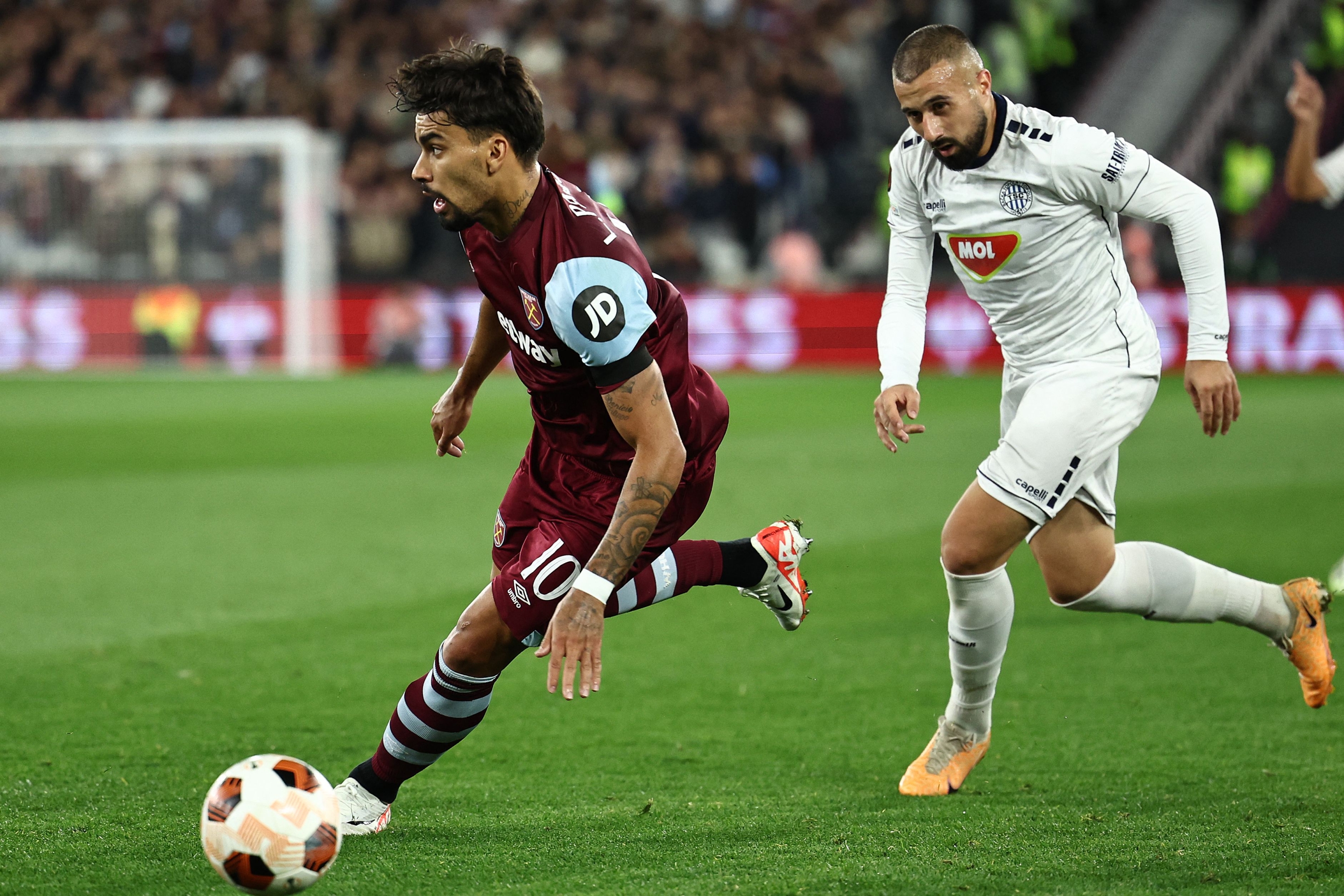 Backa Topola's Serbian midfielder #35 Ifet Dakovac challenges West Ham United's Brazilian midfielder #10 Lucas Paqueta during the UEFA Europa League group A football match between West Ham United and Backa Topola at The London Stadium in east London on September 21, 2023. (Photo by HENRY NICHOLLS / AFP)