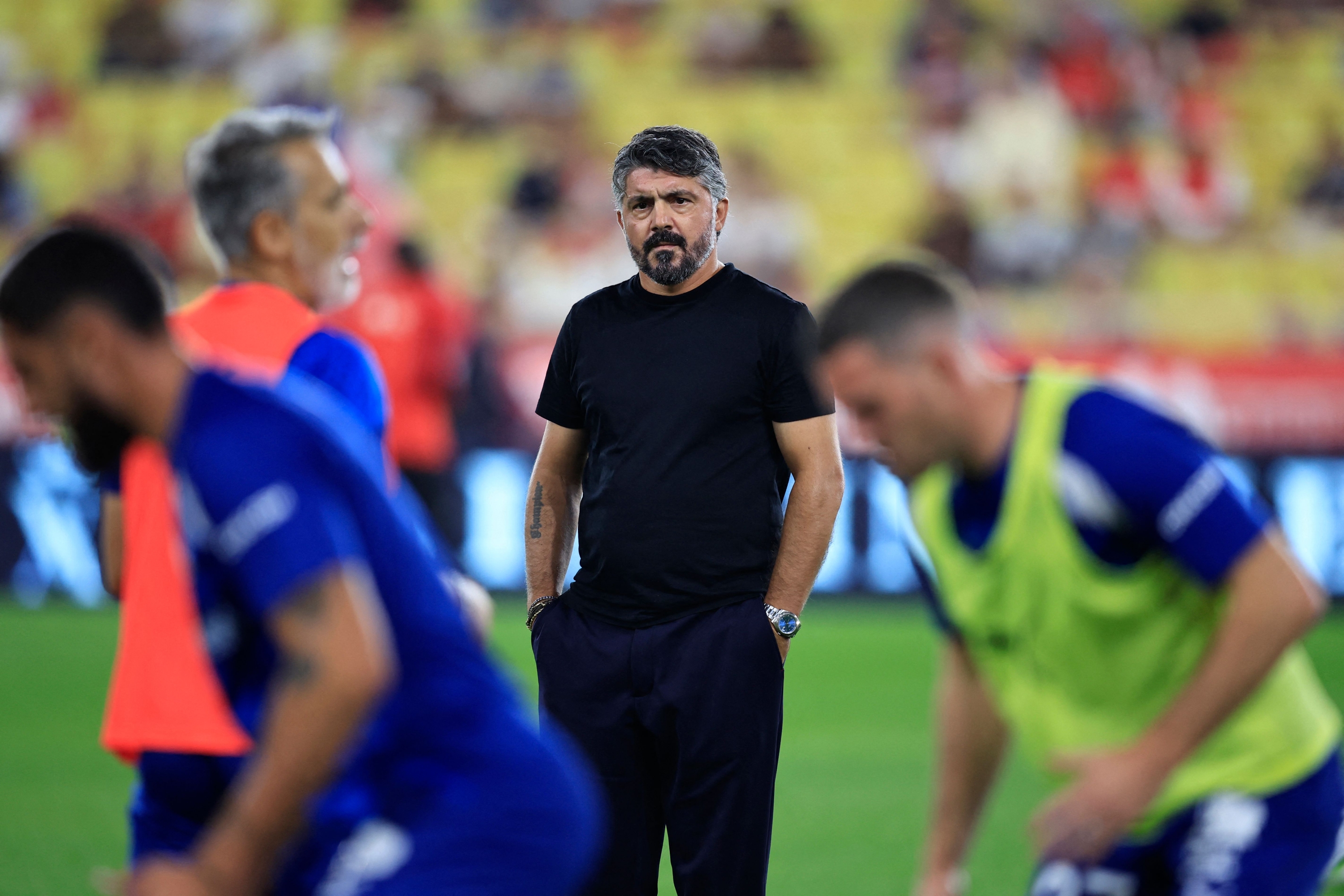 Marseille's Italian head coach Gennaro Gattuso looks at his players as they warm up prior to the start of the French L1 football match between AS Monaco and Olympique Marseille (OM) at the Louis II Stadium (Stade Louis II) in the Principality of Monaco on September 30, 2023. (Photo by Valery HACHE / AFP)