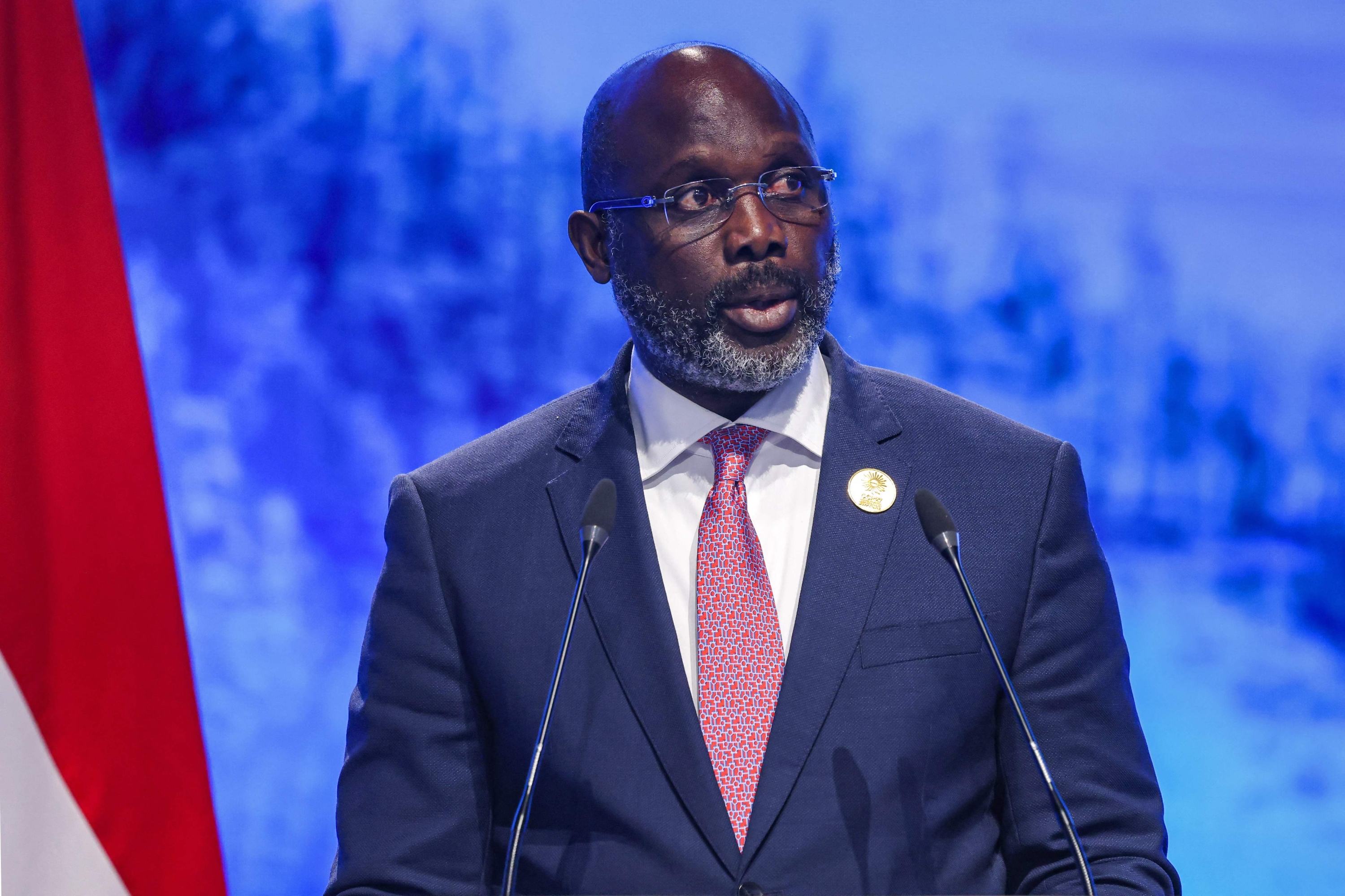 (FILES) Liberia's President George Weah delivers a speech at the leaders summit of the COP27 climate conference at the Sharm el-Sheikh International Convention Centre, in Egypt's Red Sea resort city of the same name, on November 8, 2022. Liberia's incumbent president and football legend George Weah conceded defeat on November 17, 2023 evening after nearly complete returns showed opposition leader Joseph Boakai leading with 50.89 percent of the vote. (Photo by AHMAD GHARABLI / AFP)