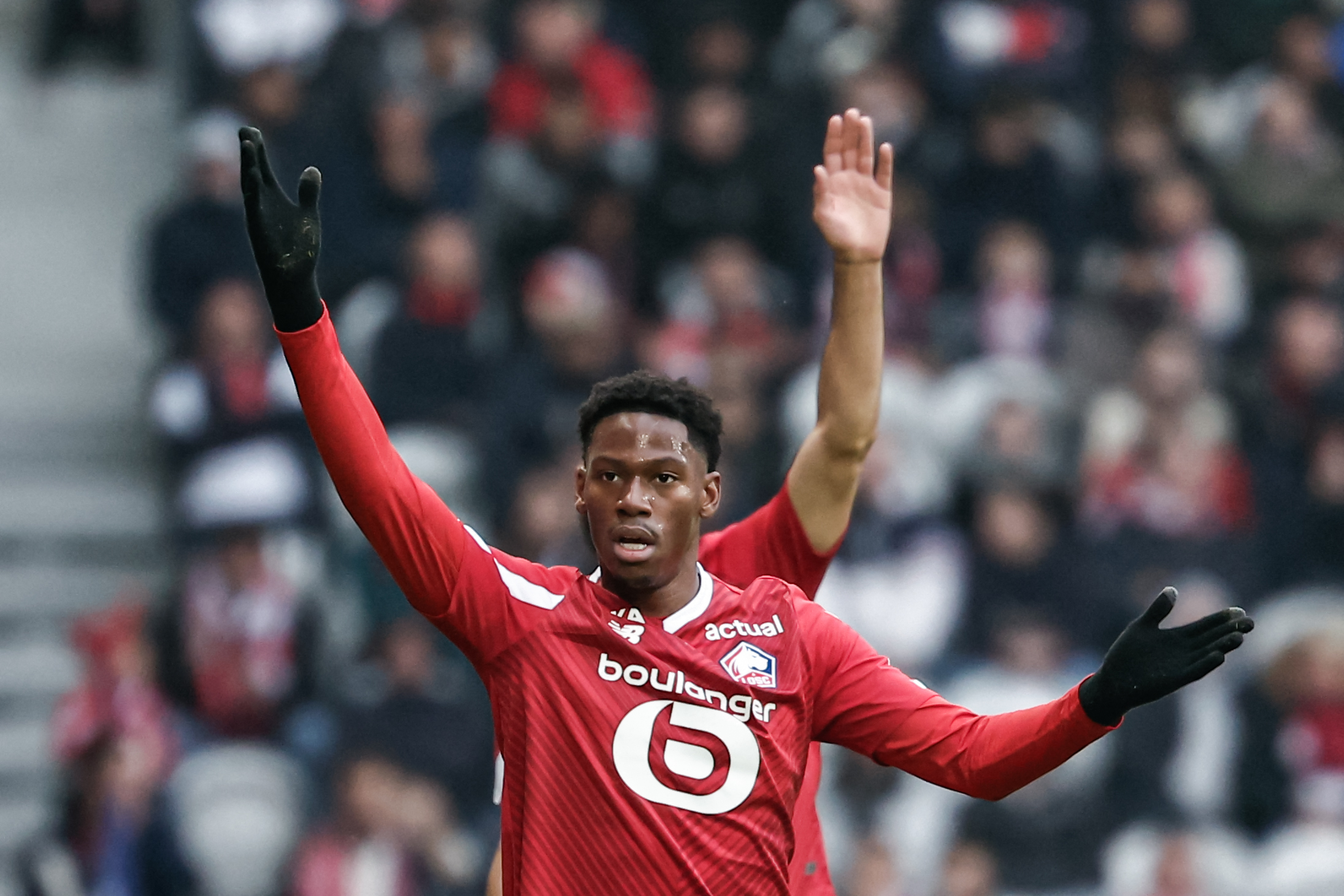 Lille's Canadian forward #09 Jonathan David reacts during the French L1 football match between Lille OSC (LOSC) and Toulouse FC (TFC) at the Stade Pierre-Mauroy in Villeneuve-d'Ascq, northern France on November 12, 2023. (Photo by Sameer Al-DOUMY / AFP)