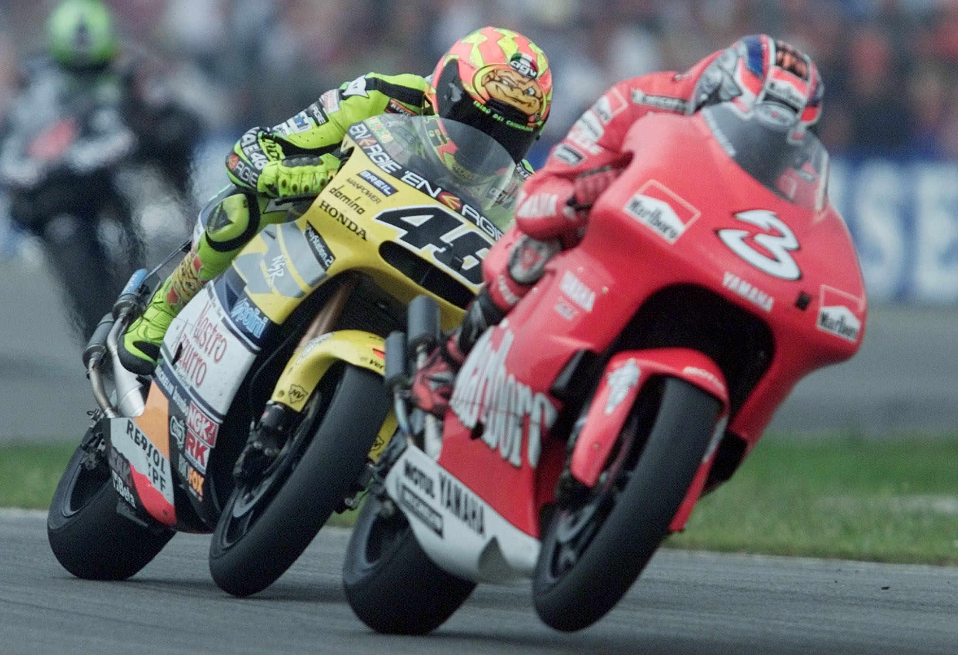 Italian 500cc riders Max Biaggi, right, and Valentino Rossi, left, in action during the Dutch 500cc motorcycle Grand Prix in Assen, The Netherlands, Saturday June 30, 2001. Biaggi won the race, Rossi finished 2nd. (AP Photo/Bas Czerwinski)