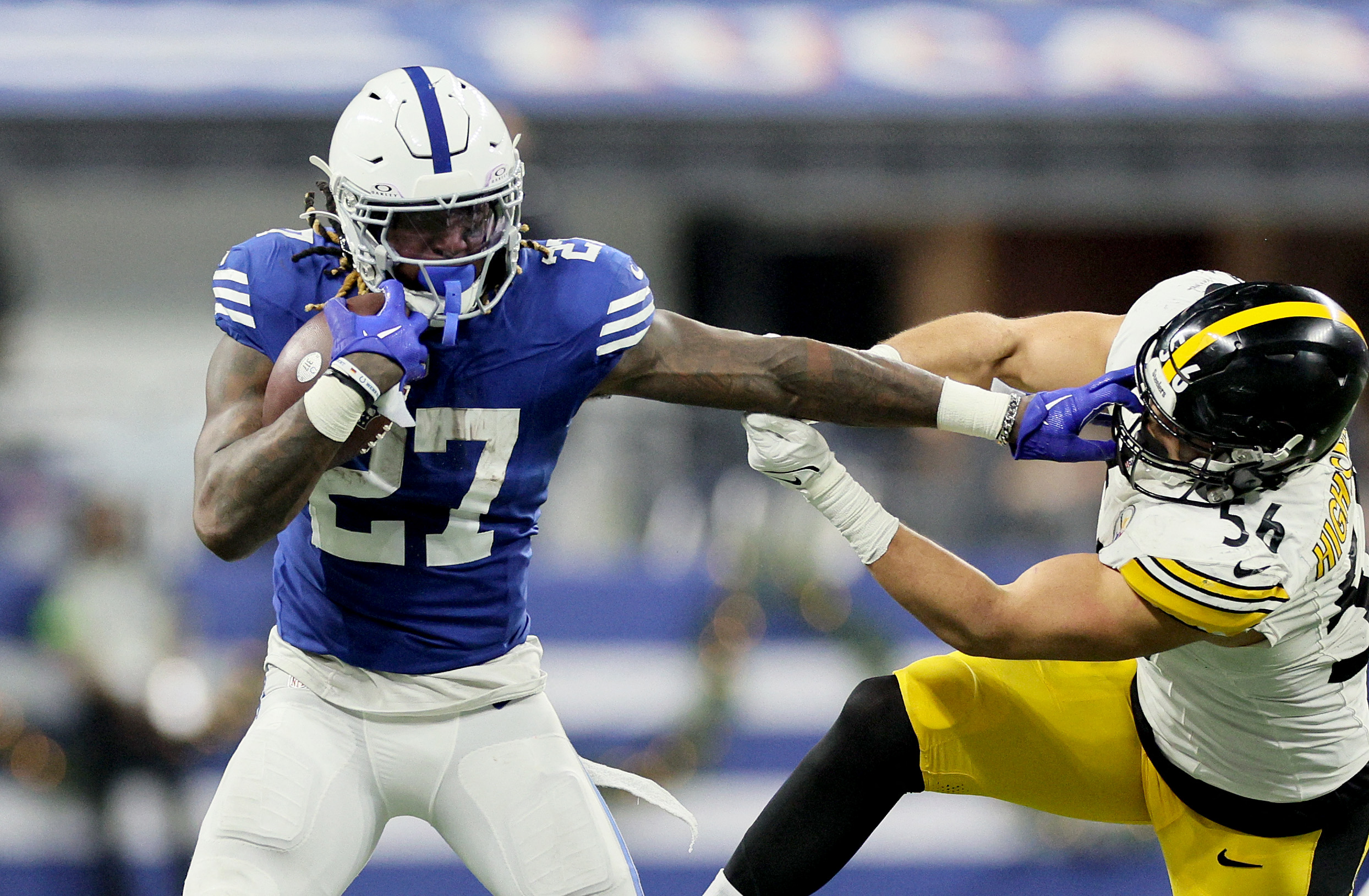 INDIANAPOLIS, INDIANA - DECEMBER 16: Trey Sermon #27 of the Indianapolis Colts stiff arms Alex Highsmith #56 of the Pittsburgh Steelers during the fourth quarter at Lucas Oil Stadium on December 16, 2023 in Indianapolis, Indiana.   Andy Lyons/Getty Images/AFP (Photo by ANDY LYONS / GETTY IMAGES NORTH AMERICA / Getty Images via AFP)