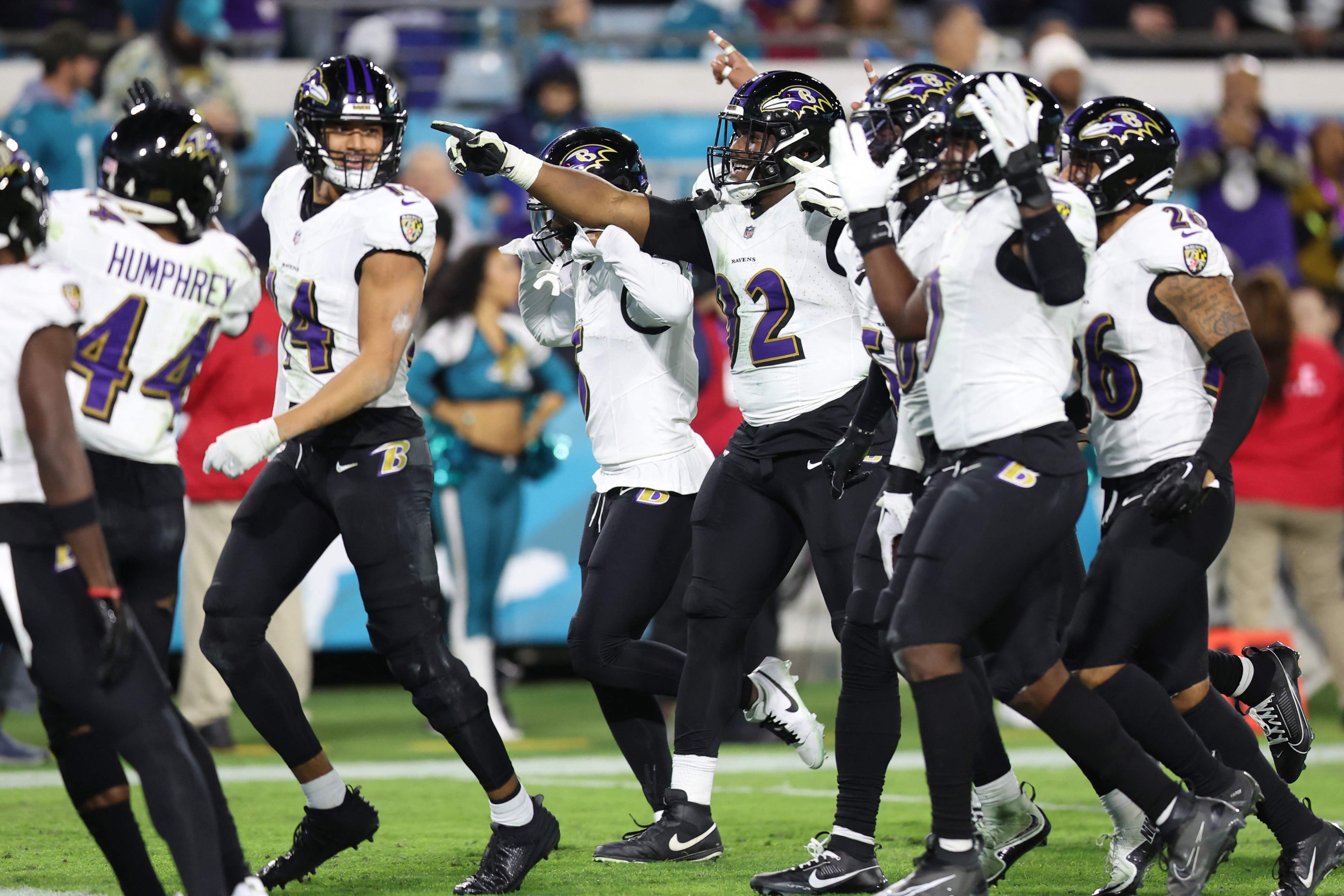 JACKSONVILLE, FLORIDA - DECEMBER 17: Justin Madubuike #92 of the Baltimore Ravens celebrates with teammates after his forced fumble against the Jacksonville Jaguars during the fourth quarter at EverBank Stadium on December 17, 2023 in Jacksonville, Florida. Madubuike tied an NFL record for 11 straight games with at least .5 sacks.   Mike Carlson/Getty Images/AFP (Photo by Mike Carlson / GETTY IMAGES NORTH AMERICA / Getty Images via AFP)