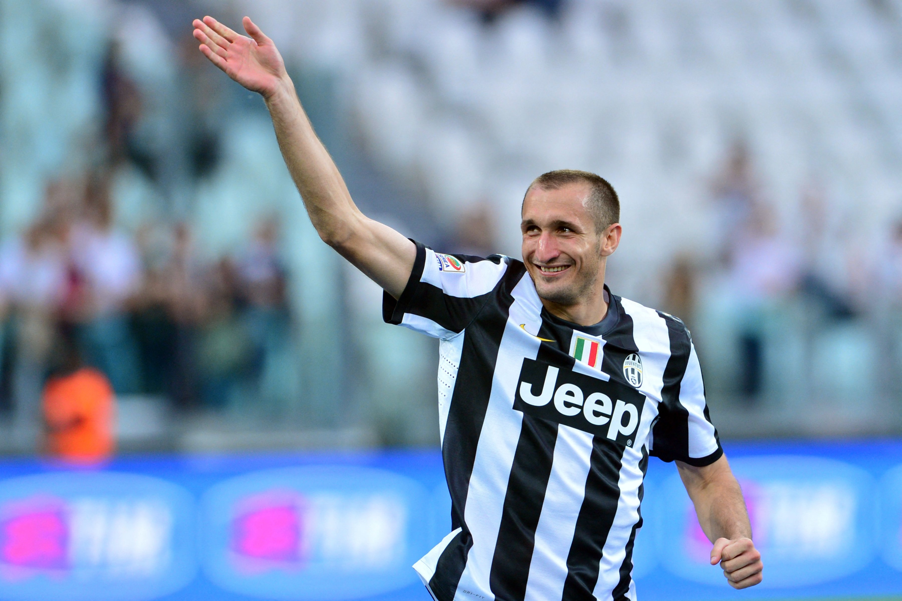 (FILES) Juventus' defender Giorgio Chiellini arrives for the ceremony of the Scudetto, the Italian Serie A trophy on the pitch after the Italian Serie A football match between Juventus and Cagliari at the "Juventus Stadium" in Turin on May 11, 2013. Former Italy and Juventus defender Chiellini revealed he would be hanging up his boots at the age of 39 in a short post on social media accompanied by a video showing the highlights of his 23 years in the professional game, on December 12, 2023. (Photo by Giuseppe CACACE / AFP)