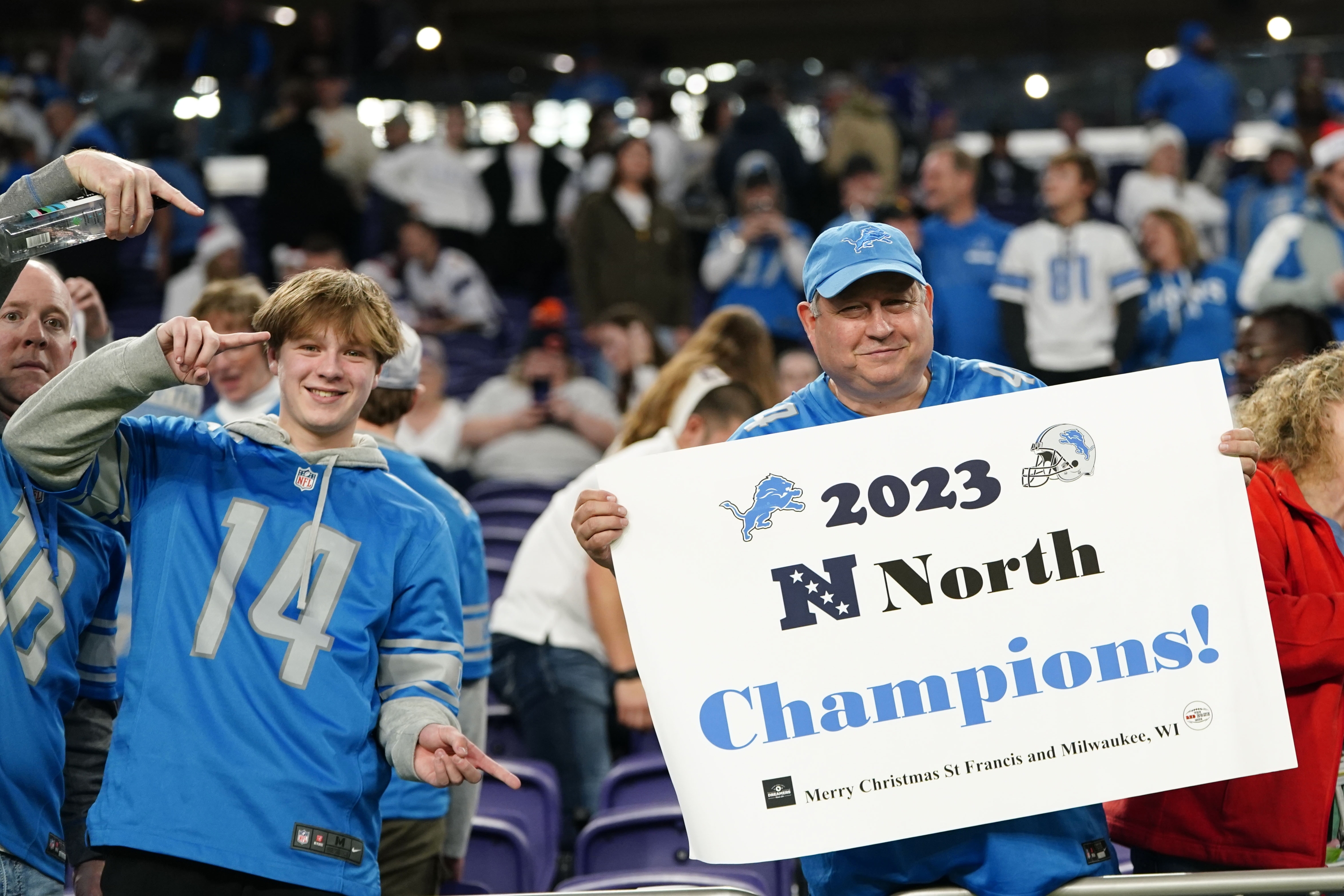 Fans celebrate after an NFL football game between the Minnesota Vikings and the Detroit Lions, Sunday, Dec. 24, 2023, in Minneapolis. The Lions won 30-24. (AP Photo/Abbie Parr)
