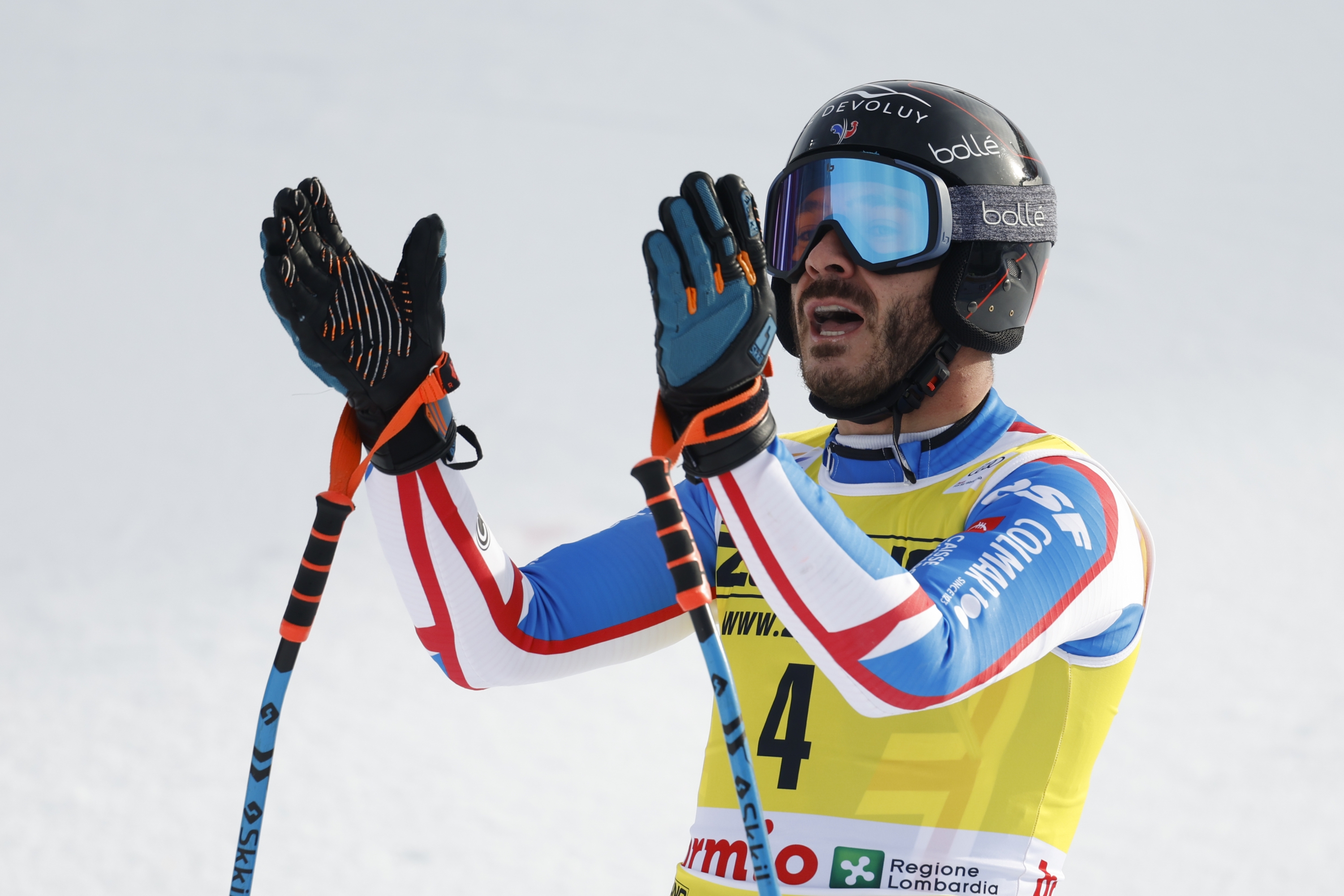 France's Cyprien Sarrazin celebrates at the finish area of an alpine ski, men's World Cup downhill race, in Bormio, Italy, Thursday, Dec. 28, 2023. (AP Photo/Alessandro Trovati)