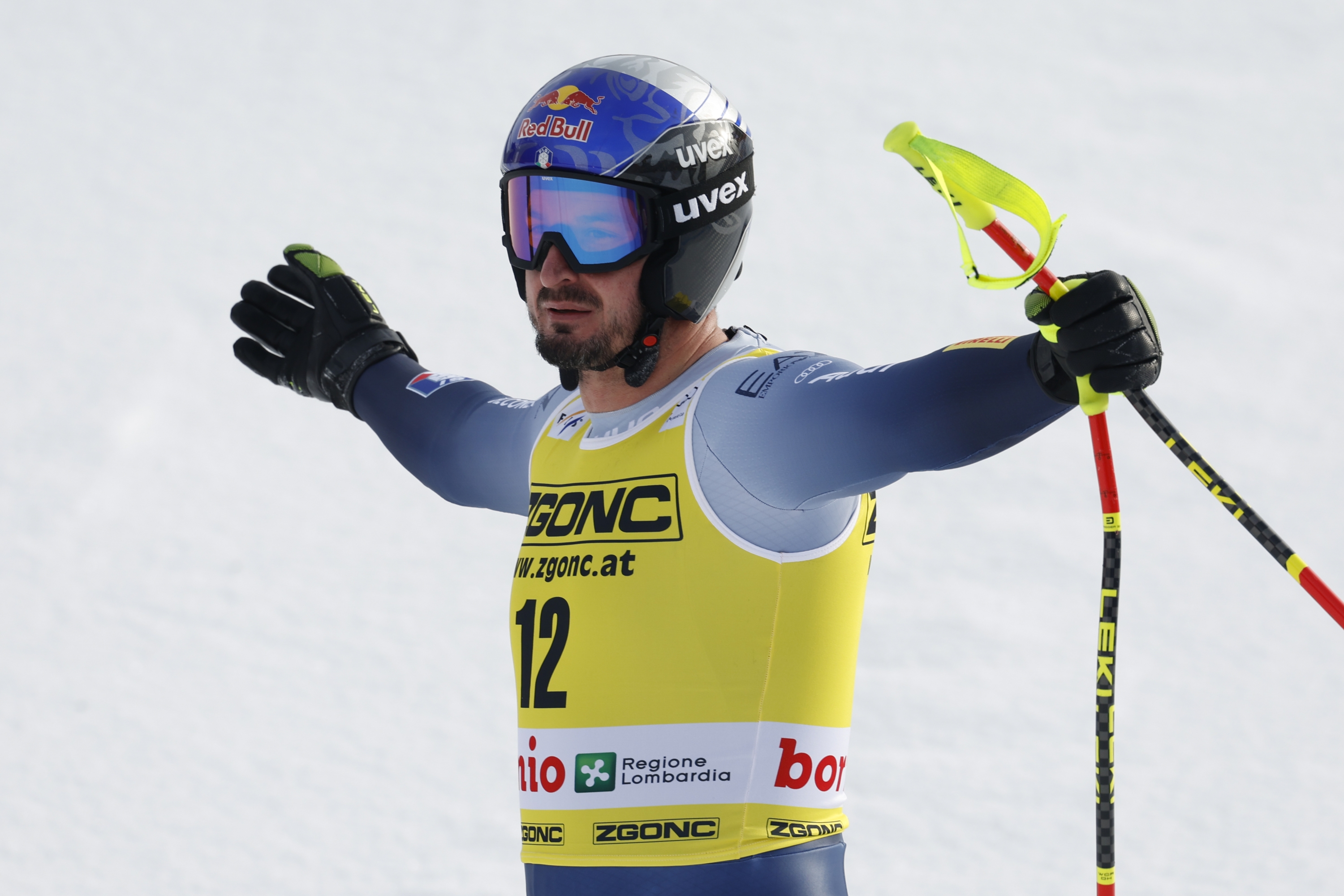 Italy's Dominik Paris reacts at the finish area of an alpine ski, men's World Cup downhill race, in Bormio, Italy, Thursday, Dec. 28, 2023. (AP Photo/Alessandro Trovati)