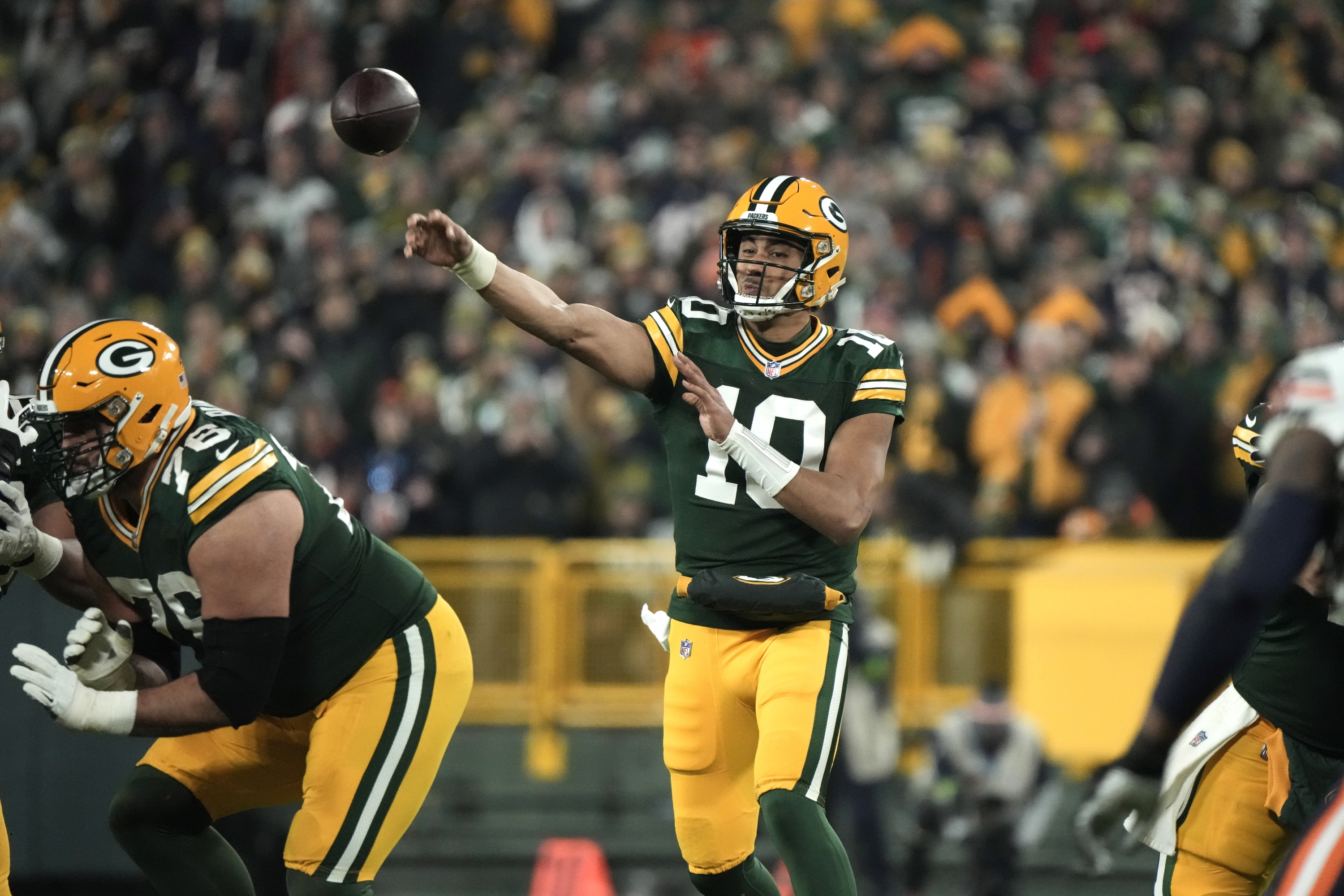 Green Bay Packers quarterback Jordan Love throws during the second half of an NFL football game against the Chicago Bears Sunday, Jan. 7, 2024, in Green Bay, Wis. (AP Photo/Morry Gash)