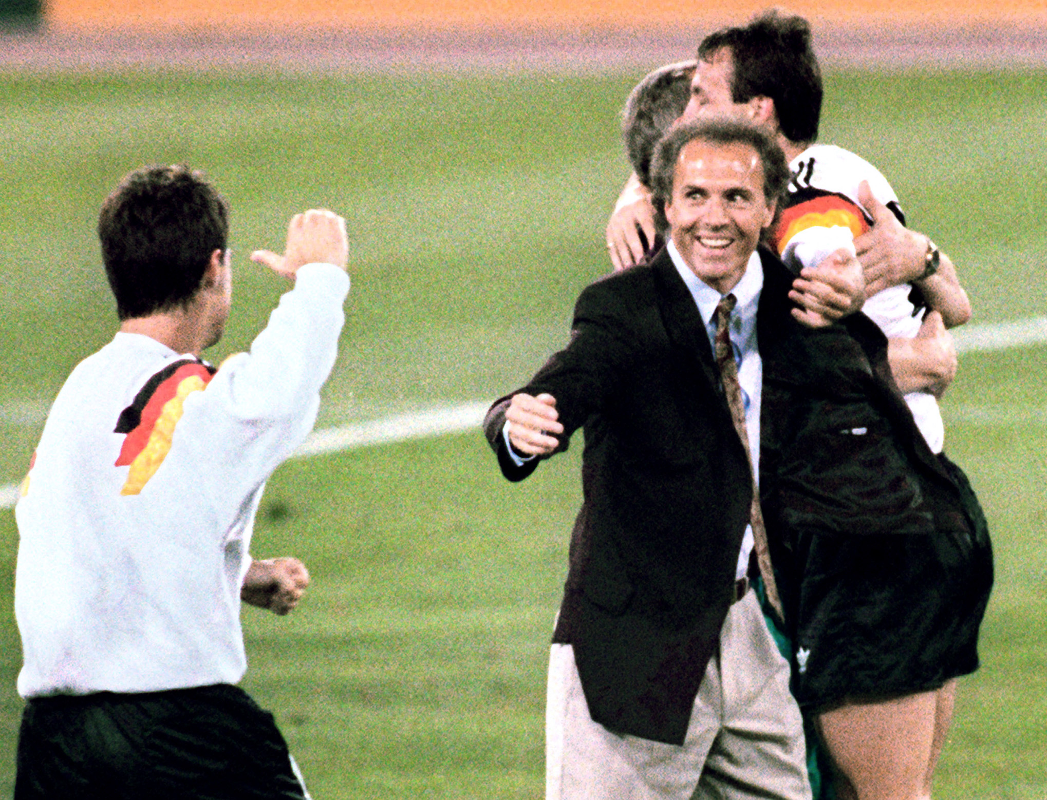 (FILES) West Germany's national soccer team coach Franz Beckenbauer (C) celebrates after his team beat the defending champions Argentina 1-0 on a penalty kick by defender Andreas Brehme in the World Cup final, 08 July 1990 in Rome. Franz Beckenbauer died aged 78 the German football association announced on January 8, 2024. (Photo by STAFF / AFP)