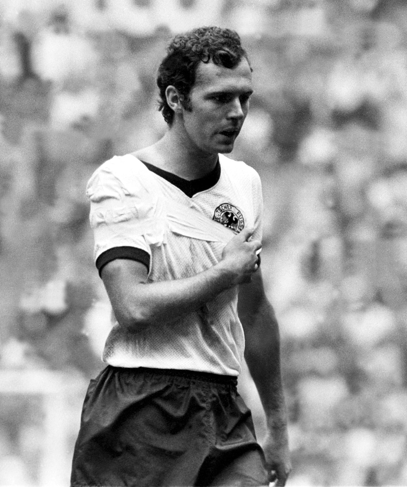 Injured German sweeper Franz Beckenbauer is playing with a bandaged shoulder at Mexico City's Aztec stadium. Beckenbauer was injured at the end of the 1970 FIFA World Cup semifinal against Italy and stuck through the 30 minutes extra time with a bandage. In the end Germany loses 3:4. (Photo by Werek / werek / dpa Picture-Alliance via AFP)