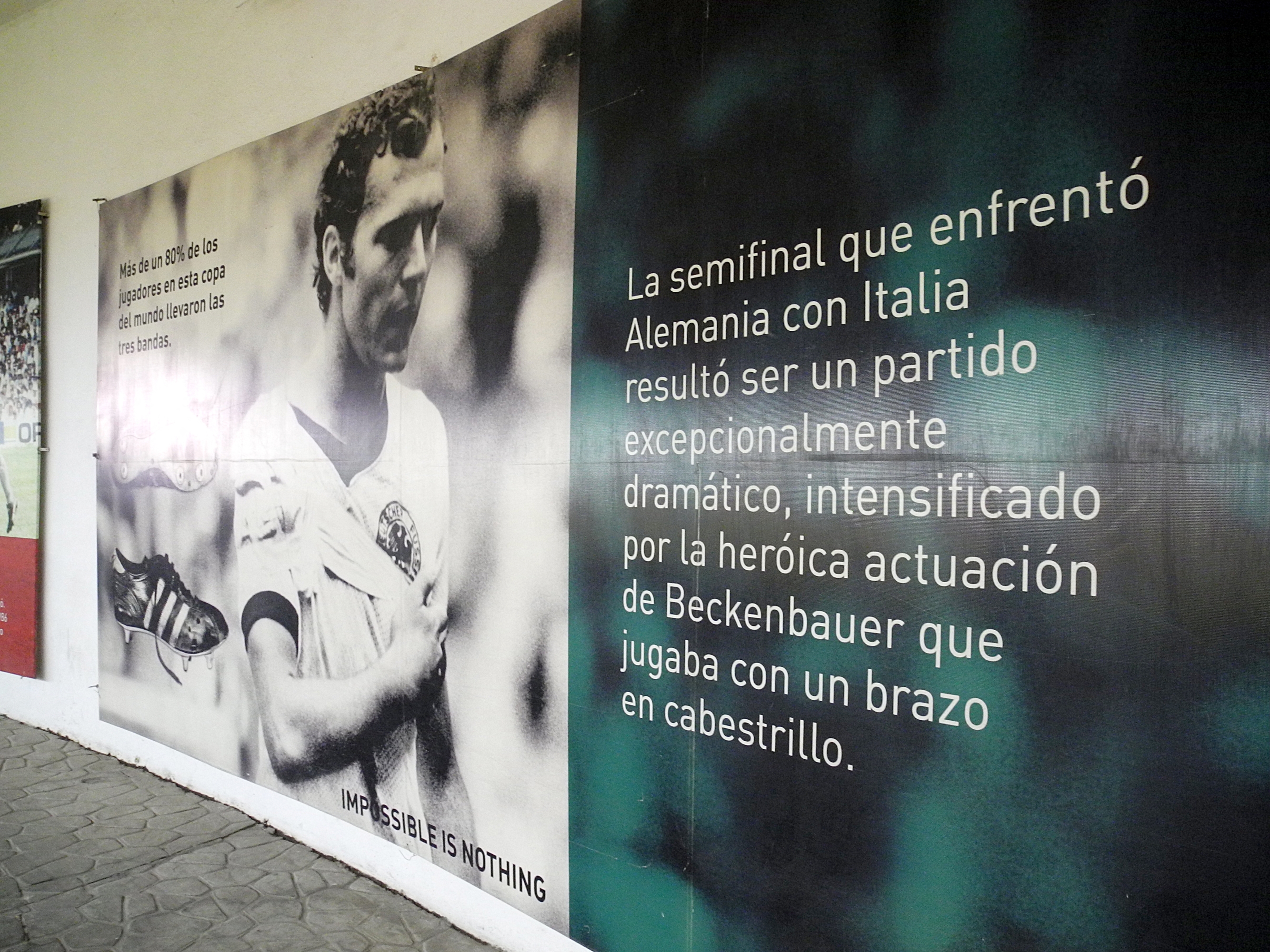 A photo in the catacombs of the Estadio Azteca commemorates Franz Beckenbauer, who played for West Germany in the 'Game of the Century' against Italy during the 1970 FIFA World Cup with a bandaged arm, in Mexico City, Mexico, 4 May 2016. The Estadio Azteca opened in 1966. Photo: Denis Duettmann/dpa (Photo by Denis Düttmann / DPA / dpa Picture-Alliance via AFP)
