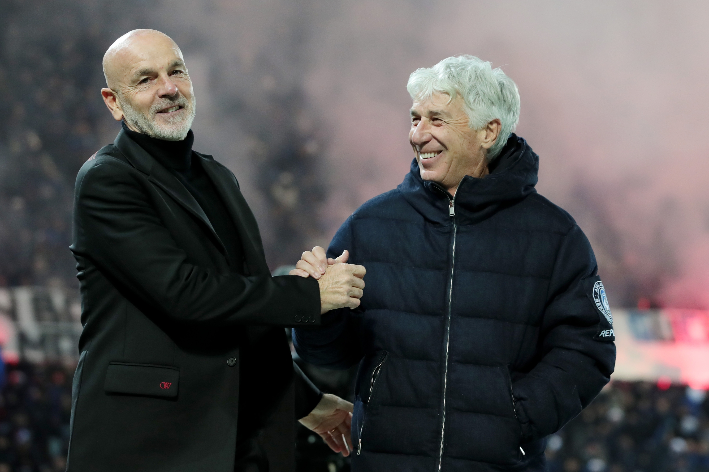 BERGAMO, ITALY - DECEMBER 09: Stefano Pioli, Head Coach of AC Milan, shakes hands with Gian Piero Gasperini, Head Coach of Atalanta BC, prior to the Serie A TIM match between Atalanta BC and AC Milan at Gewiss Stadium on December 09, 2023 in Bergamo, Italy. (Photo by Emilio Andreoli/Getty Images)