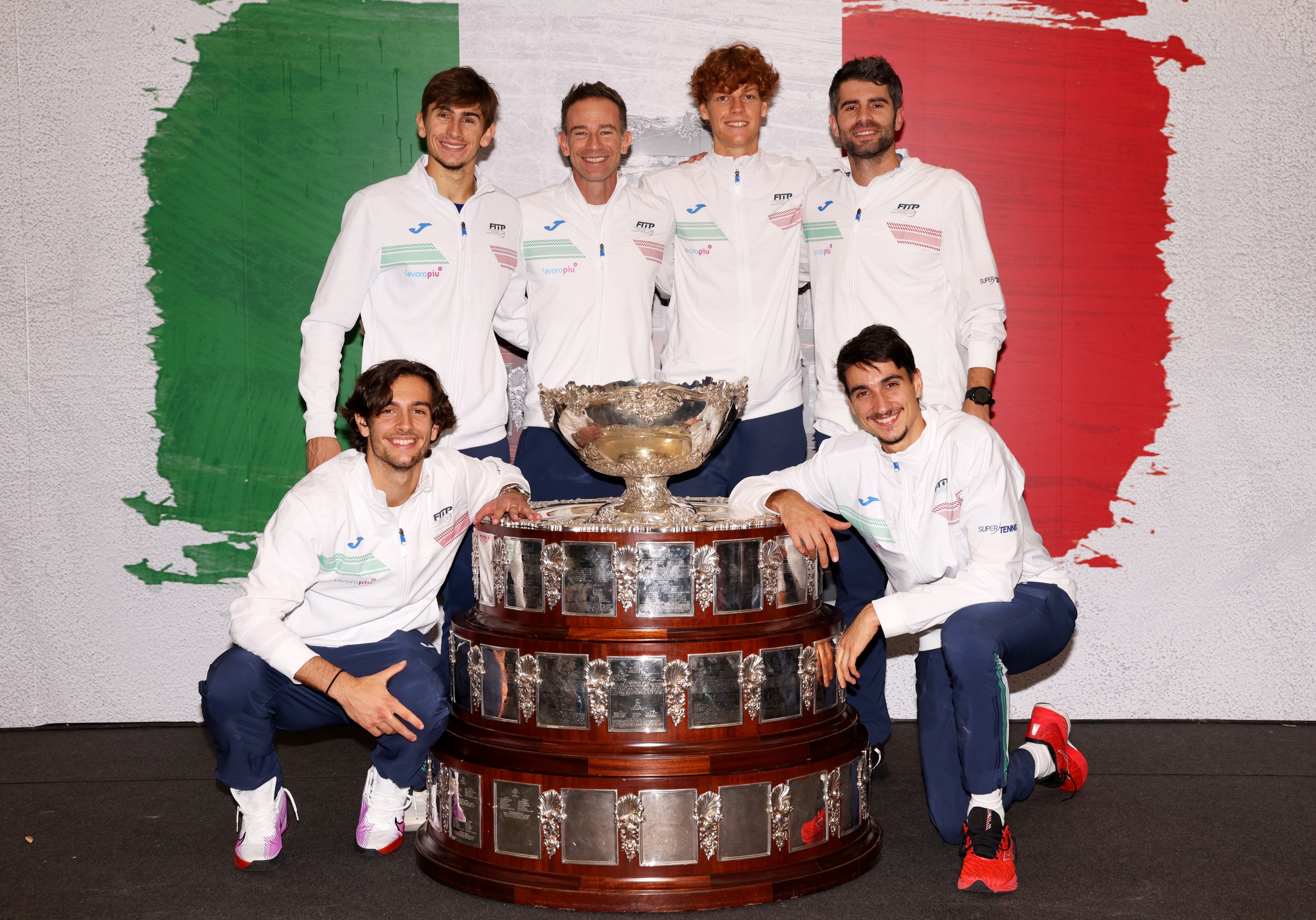 MALAGA, SPAIN - NOVEMBER 26: (L-R) Lorenzo Musetti, Matteo Arnaldi, Filippo Volandri, Jannik Sinner, Simone Bolelli and Lorenzo Sonego of Italy pose for a photo with the Davis Cup Trophy after their teams victory during the Davis Cup Final match against Australia at Palacio de Deportes Jose Maria Martin Carpena on November 26, 2023 in Malaga, Spain. (Photo by Clive Brunskill/Getty Images for ITF)