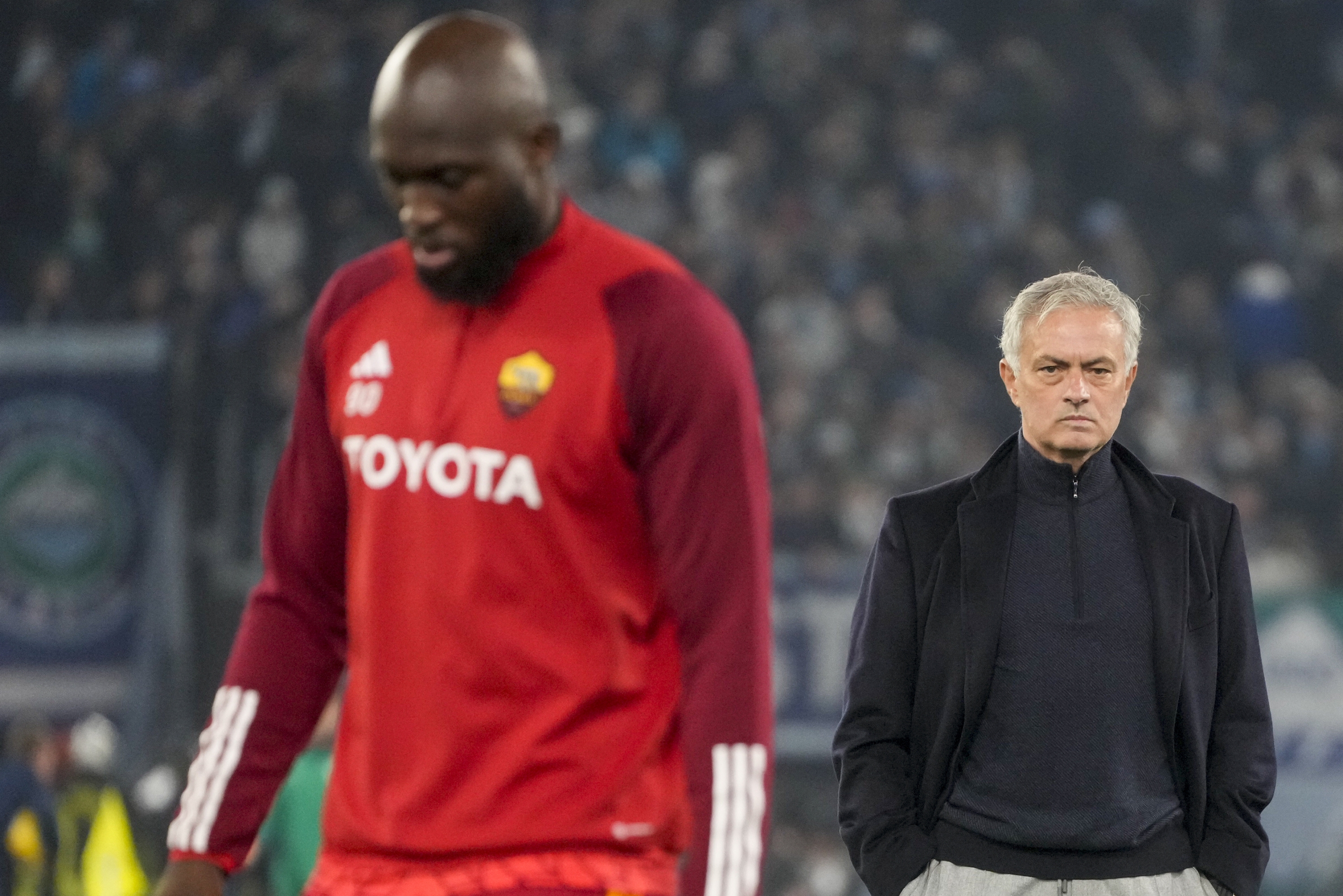 Roma's Romelu Lukaku walks by head coach Jose Mourinho during the warm up ahead of the quarterfinal Italian Cup soccer match between Lazio and Roma at Rome's Olympic Stadium, Wednesday, Jan. 10, 2024. (AP Photo/Gregorio Borgia)