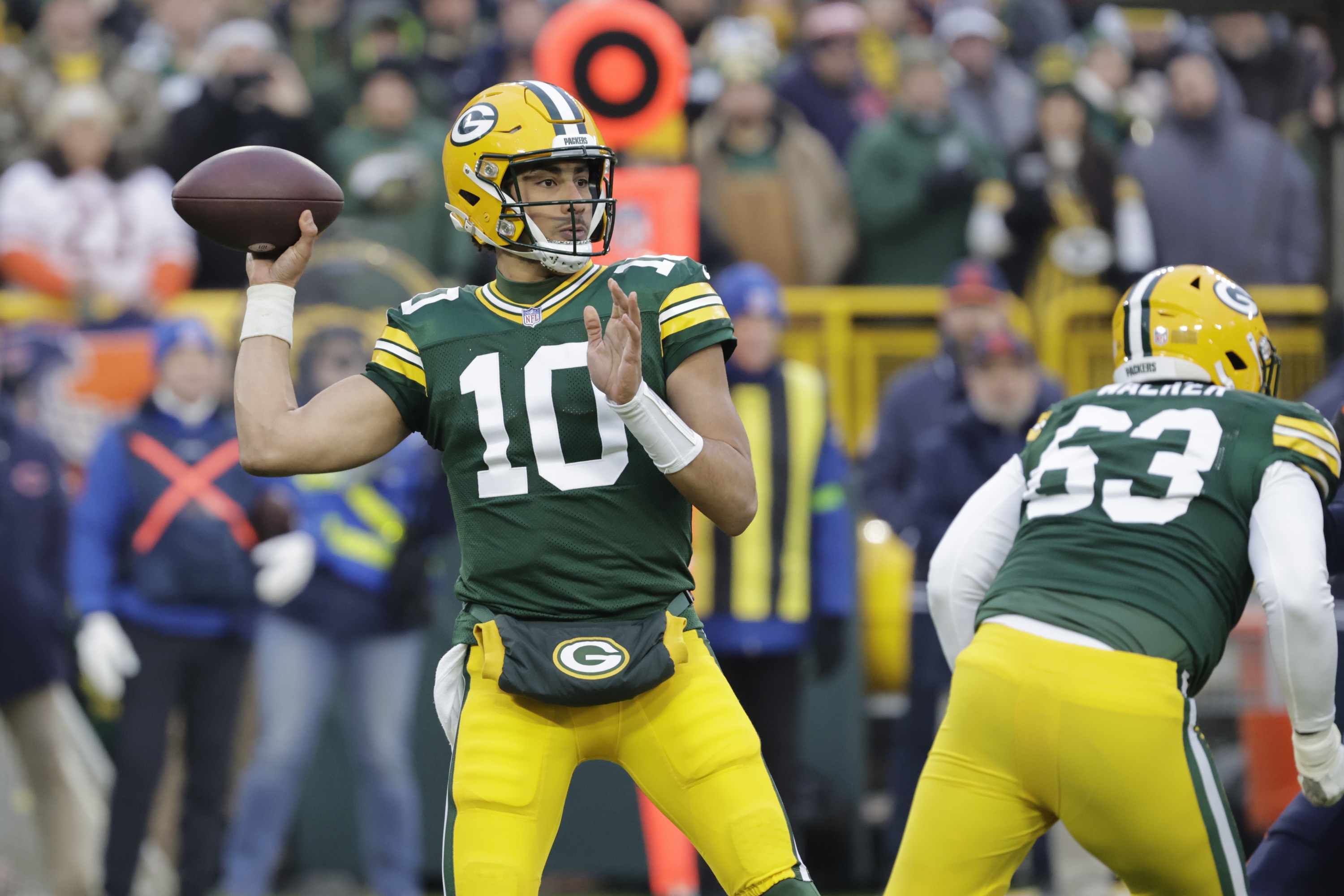 Green Bay Packers quarterback Jordan Love throws during the first half of an NFL football game against the Chicago Bears Sunday, Jan. 7, 2024, in Green Bay, Wis. (AP Photo/Mike Roemer)