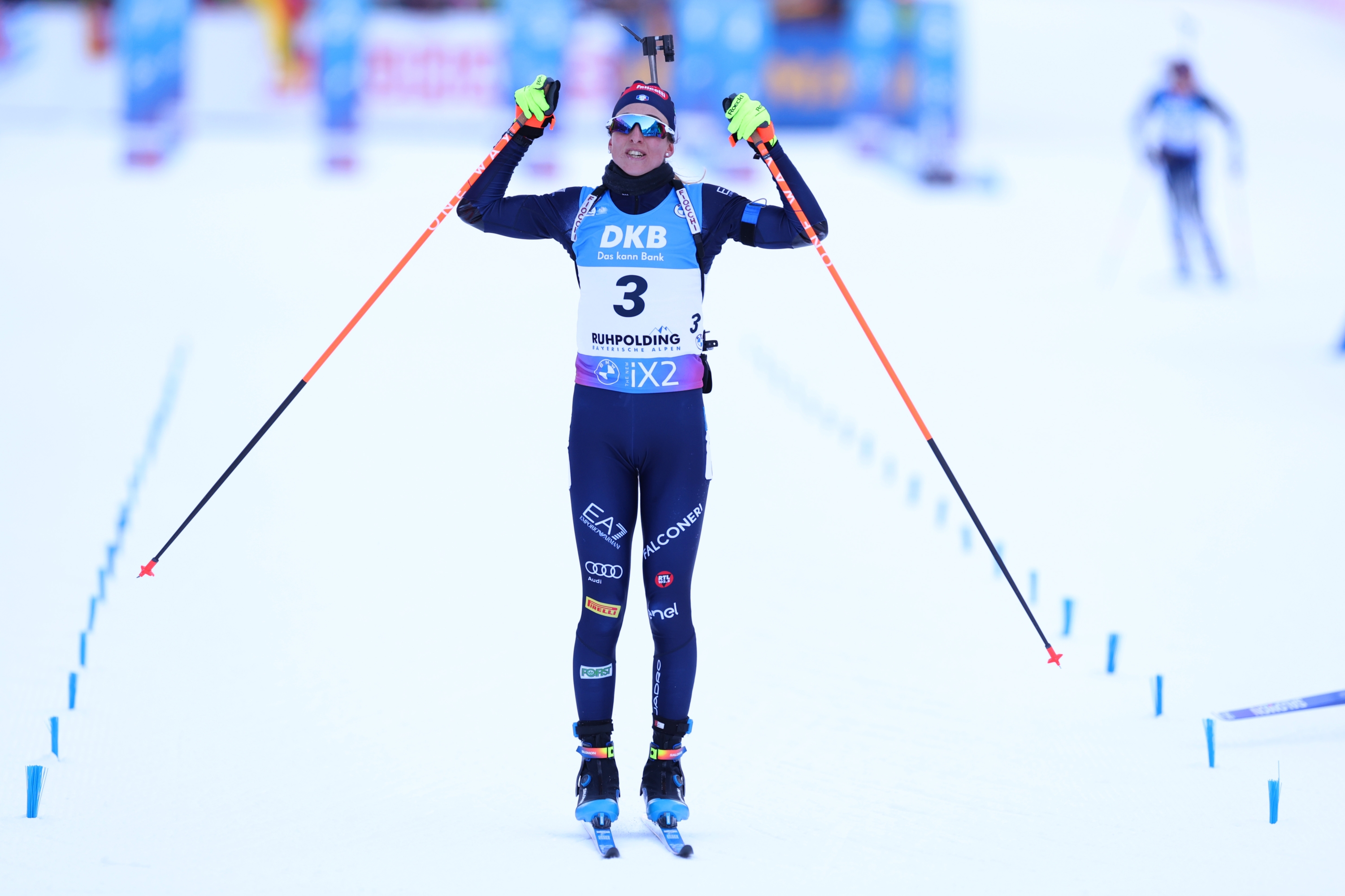 RUHPOLDING, GERMANY - JANUARY 14: Lisa Vittozzi of Team Italy celebrates as she crosses the line after winning the Women 10 km Pursuit at the BMW IBU World Cup Biathlon Ruhpolding on January 14, 2024 in Ruhpolding, Germany. (Photo by Alexander Hassenstein/Getty Images)