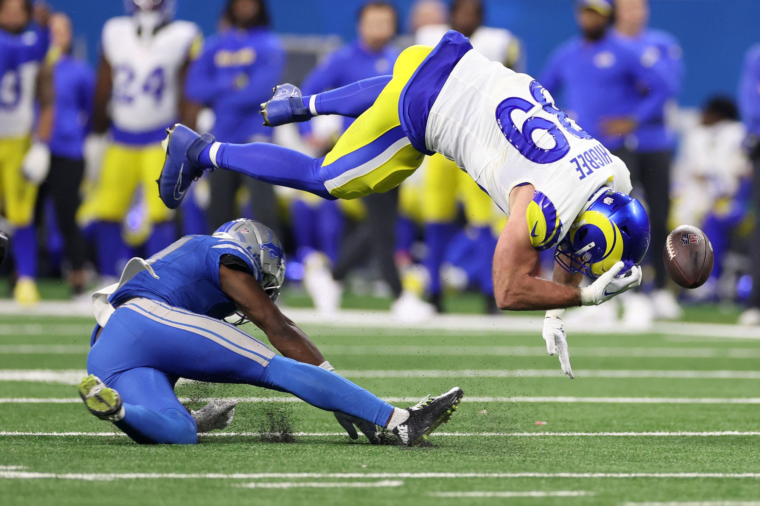 DETROIT, MICHIGAN - JANUARY 14: Tyler Higbee #89 of the Los Angeles Rams is hit by Kerby Joseph #31 of the Detroit Lions during the second half in the NFC Wild Card Playoffs at Ford Field on January 14, 2024 in Detroit, Michigan.   Gregory Shamus/Getty Images/AFP (Photo by Gregory Shamus / GETTY IMAGES NORTH AMERICA / Getty Images via AFP)