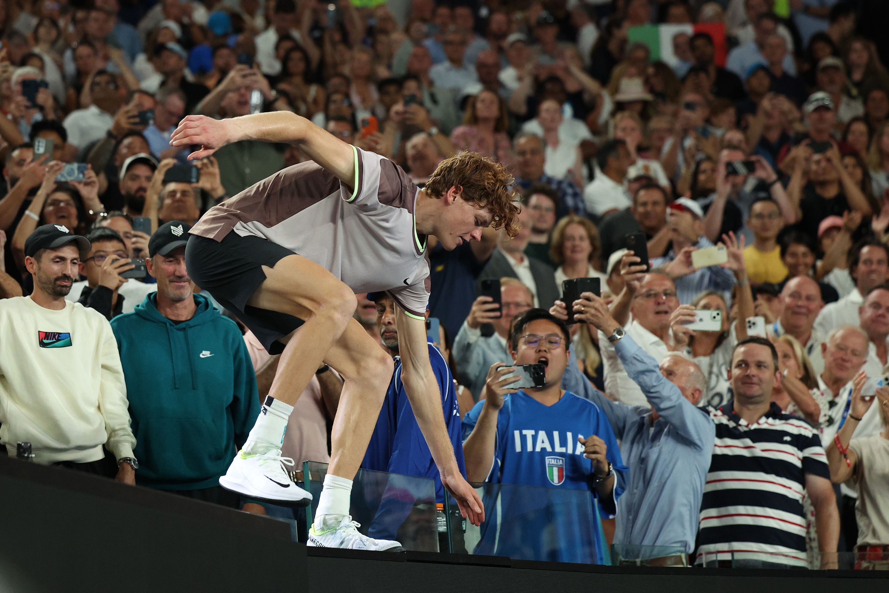 MELBOURNE, AUSTRALIA - JANUARY 28: Jannik Sinner of Italy celebrates winning with his team after their Men's Singles Final match against Daniil Medvedev during the 2024 Australian Open at Melbourne Park on January 28, 2024 in Melbourne, Australia. (Photo by Daniel Pockett/Getty Images)
