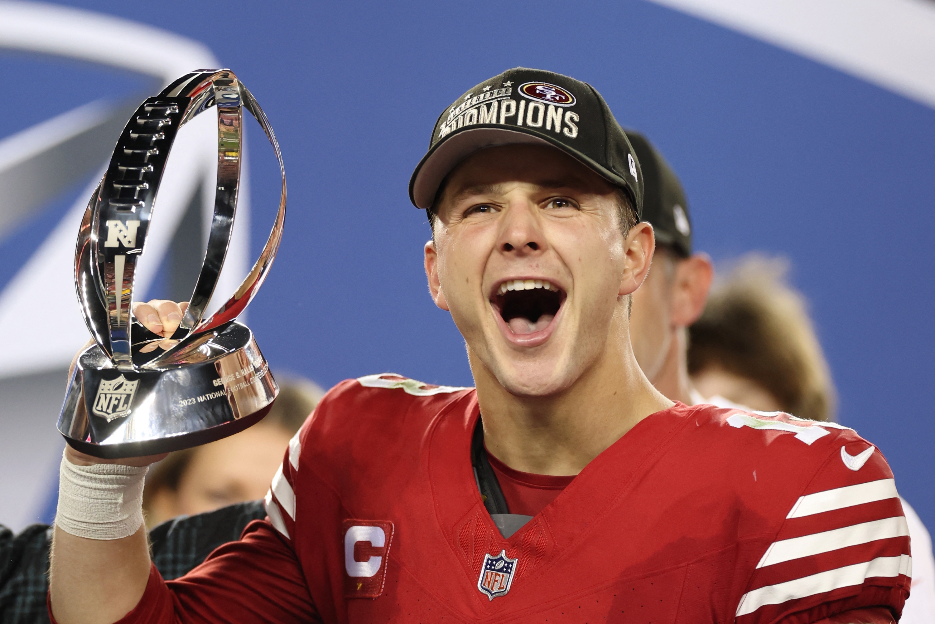 SANTA CLARA, CALIFORNIA - JANUARY 28: Brock Purdy #13 of the San Francisco 49ers reacts as he holds the George Halas Trophy after defeating the Detroit Lions 34-31 in the NFC Championship Game at Levi's Stadium on January 28, 2024 in Santa Clara, California.   Ezra Shaw/Getty Images/AFP (Photo by EZRA SHAW / GETTY IMAGES NORTH AMERICA / Getty Images via AFP)