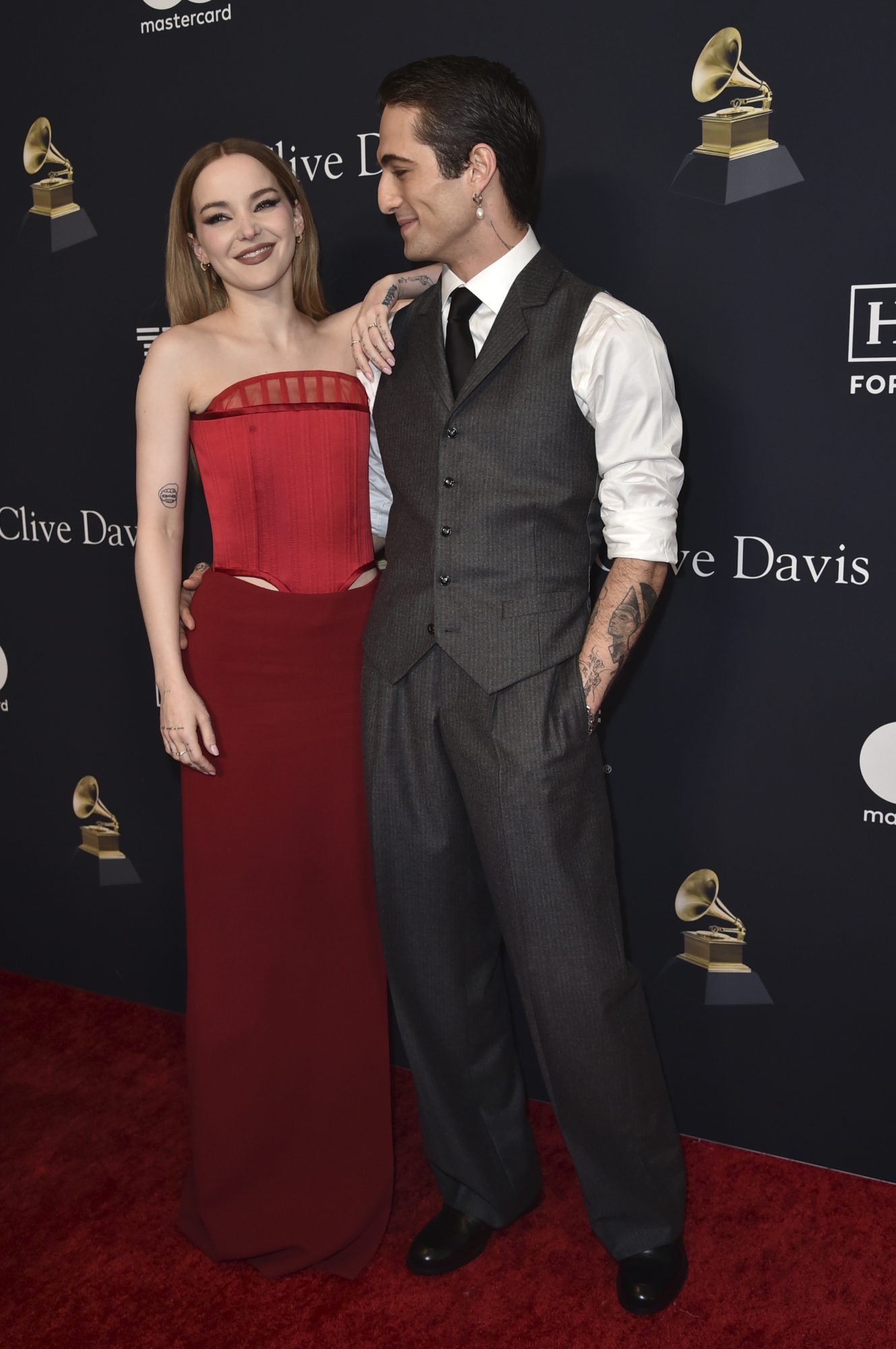 Dove Cameron, left, and Damiano David arrive at the Pre-Grammy Gala on Saturday, Feb. 3, 2024, at the Beverly Hilton Hotel in Beverly Hills, Calif. (Photo by Richard Shotwell/Invision/AP)