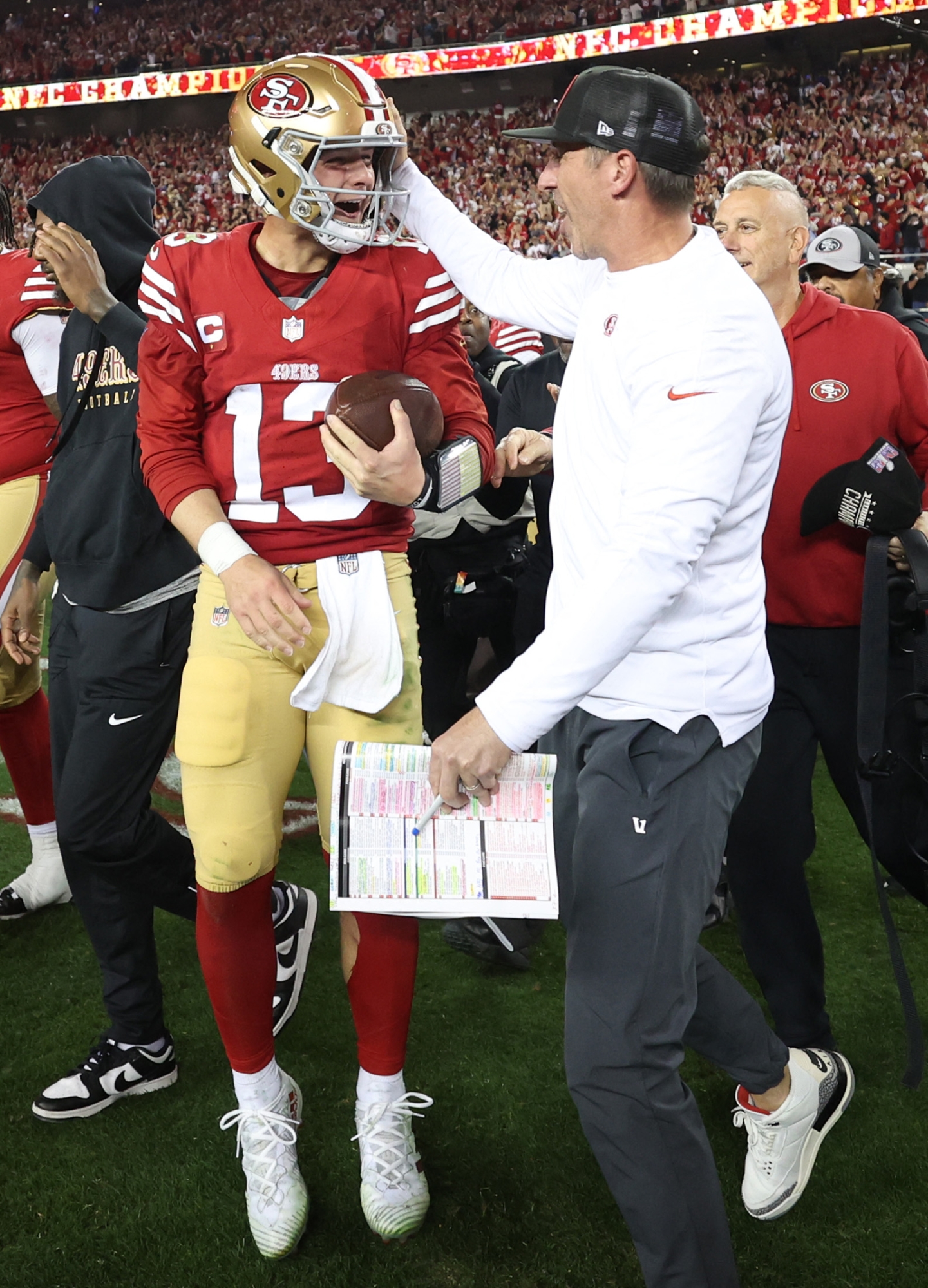 SANTA CLARA, CALIFORNIA - JANUARY 28: Brock Purdy #13 of the San Francisco 49ers celebrates with Head coach Kyle Shanahan after defeating the Detroit Lions 34-31 in the NFC Championship Game at Levi's Stadium on January 28, 2024 in Santa Clara, California.   Ezra Shaw/Getty Images/AFP (Photo by EZRA SHAW / GETTY IMAGES NORTH AMERICA / Getty Images via AFP)