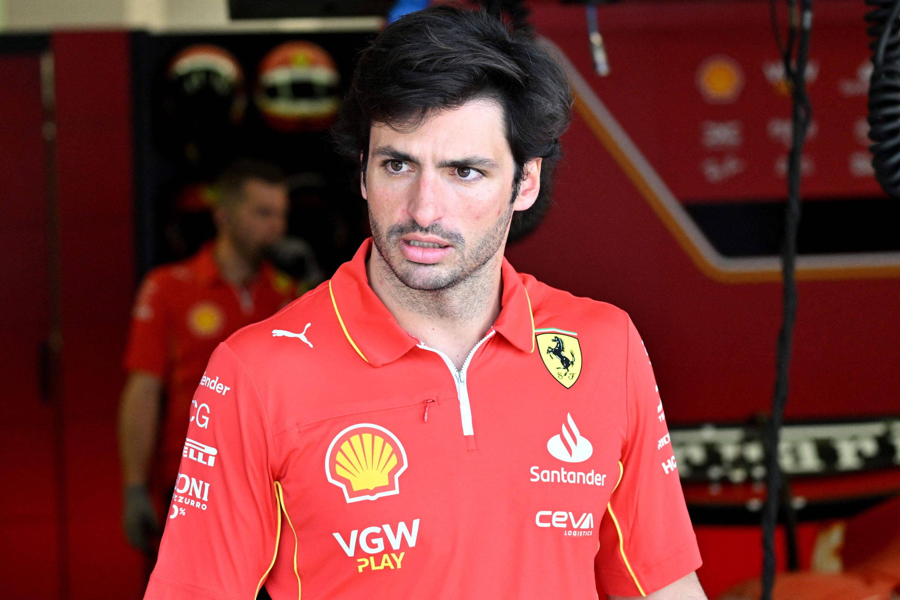Ferrari's Spanish driver Carlos Sainz Jr is seen in the garage during the second day of the Formula One pre-season testing at the Bahrain International Circuit in Sakhir on February 22, 2024. (Photo by Andrej ISAKOVIC / AFP)