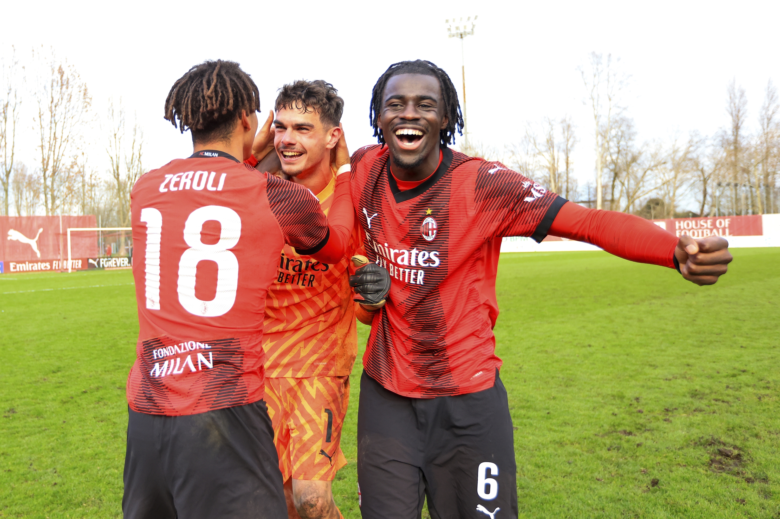 MILAN, ITALY - FEBRUARY 28: (L-R) Kevin Zeroli of AC Milan, Noah Raveyre and Clinton Nsiala Makengo celebrates the win at end of   the UEFA Youth League Round of 16 tie between AC Milan U19 and Braga U19 at Centro Sportivo Vismara on February 28, 2024 in Milan, Italy. (Photo by Giuseppe Cottini/AC Milan via Getty Images)