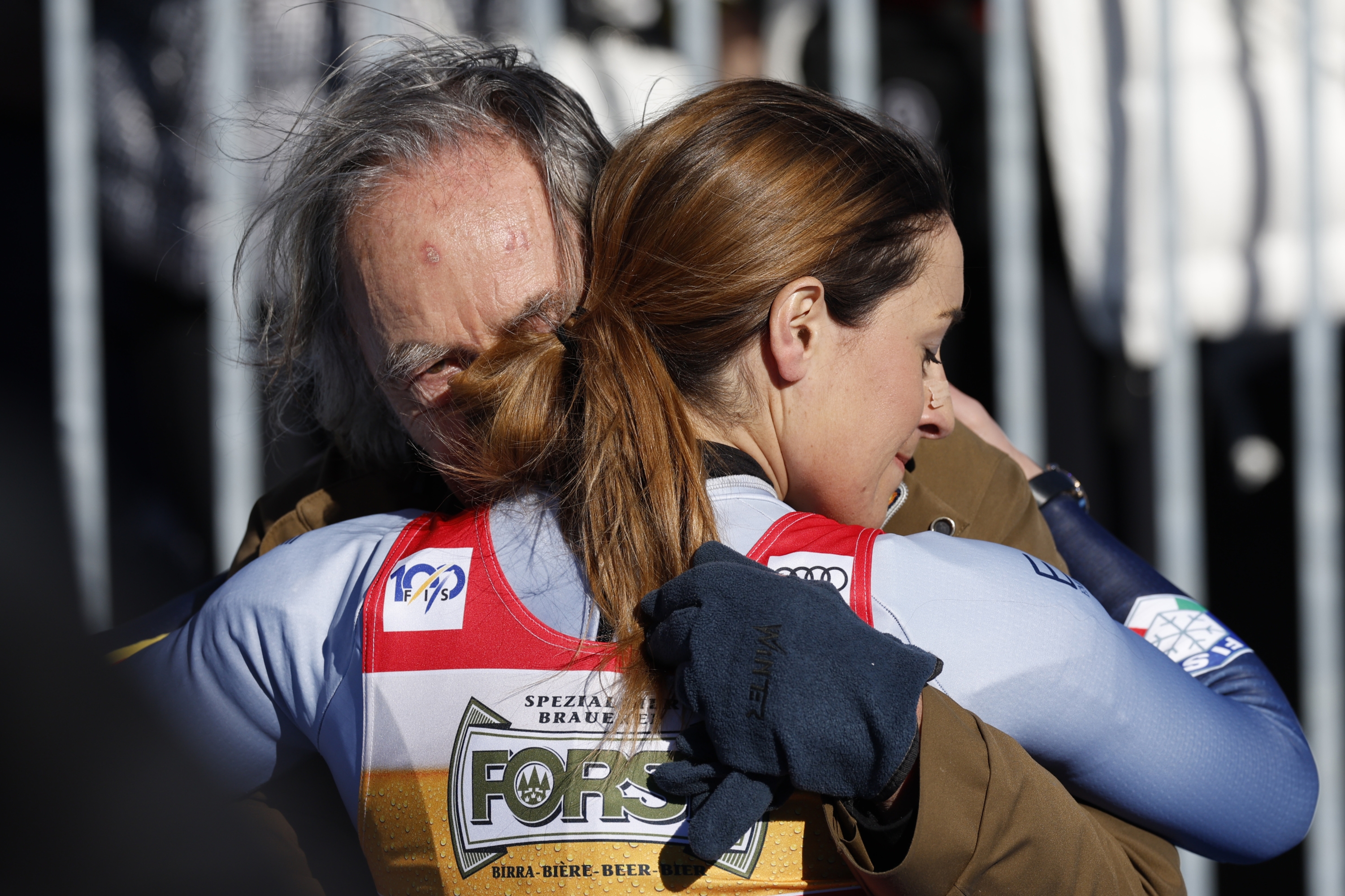 Italy's Sofia Goggia embraces her father Enzo after concluding an alpine ski, women's World Cup downhill race, in Cortina d'Ampezzo, Italy, Saturday, Jan. 27, 2024. (AP Photo/Alessandro Trovati)