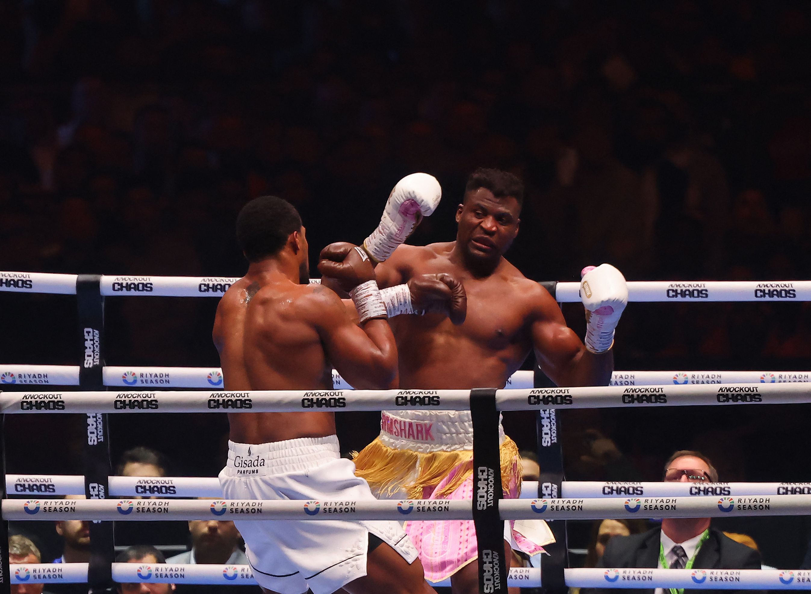 British boxer Anthony Joshua (L) competes with Cameroonian-French boxer Francis Ngannou during their heavyweight boxing match in Riyadh's Kingdom Arena indoor stadium, on March 9, 2024. (Photo by Fayez Nureldine / AFP)