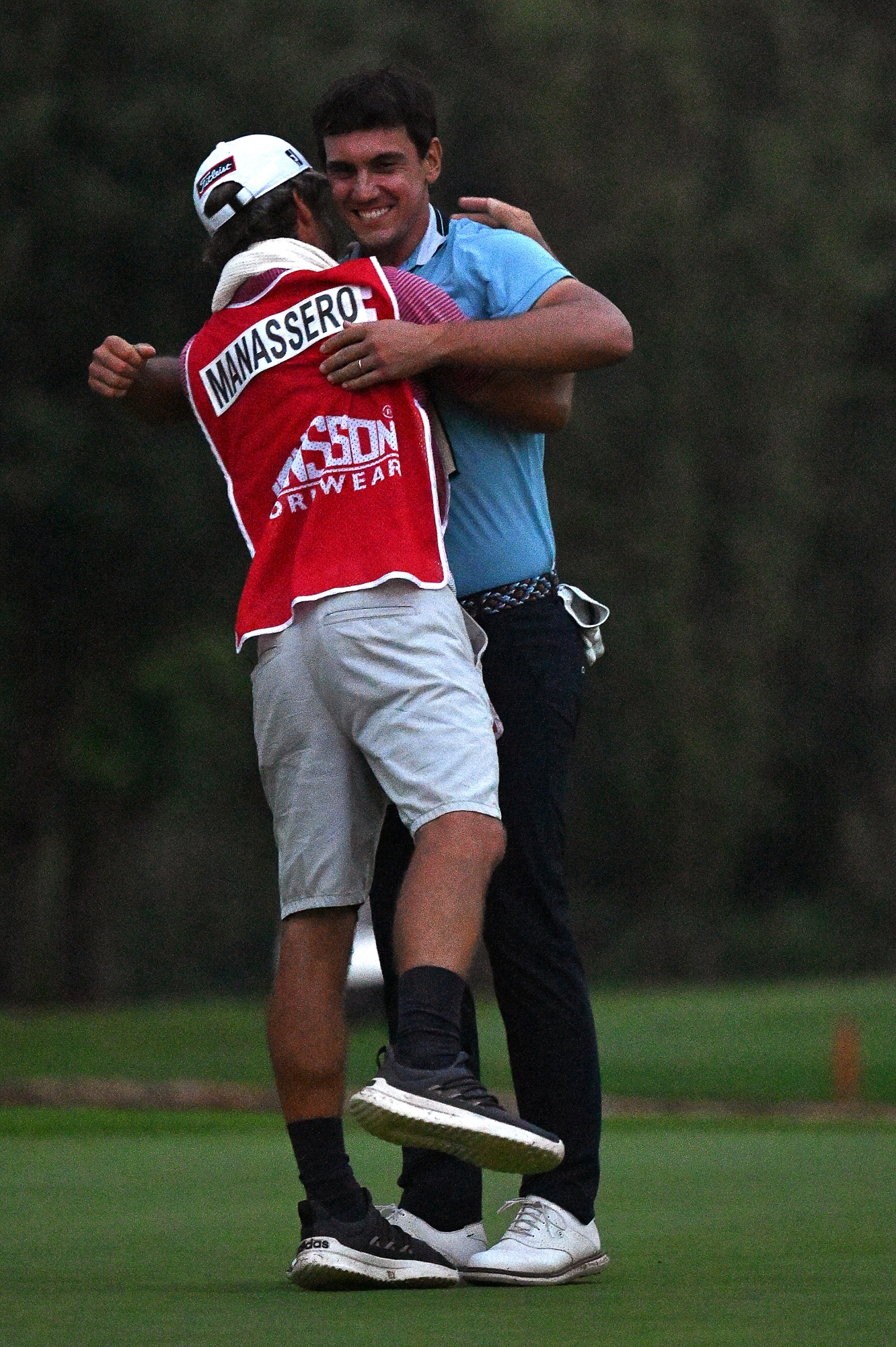 JOHANNESBURG, SOUTH AFRICA - MARCH 10: Matteo Manassero of Italy celebrates victory with his caddie on the 18th green during day four of the Jonsson Workwear Open at Glendower Golf Club on March 10, 2024 in Johannesburg, South Africa. (Photo by Stuart Franklin/Getty Images)