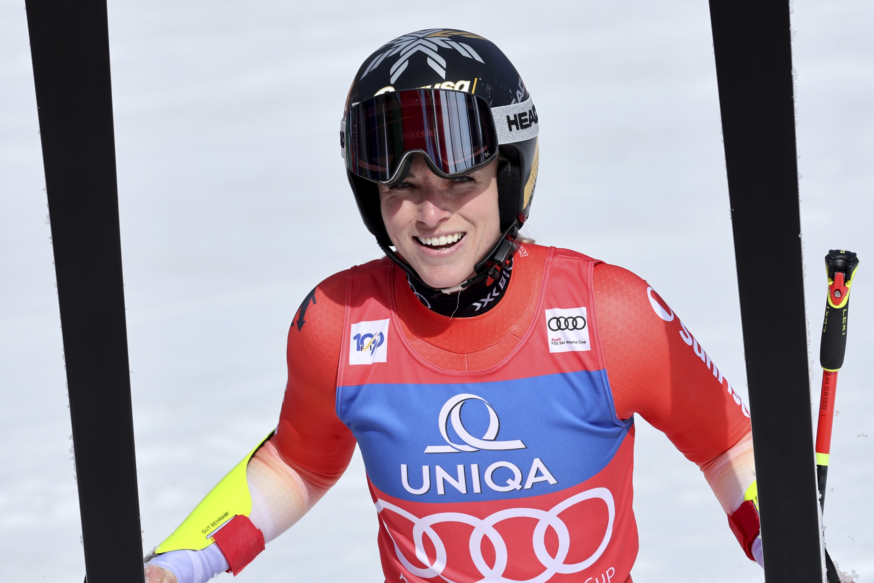 Switzerland's Lara Gut Behrami celebrates at the finish area of an alpine ski, women's World Cup giant slalom race, in Saalbach, Austria, Sunday, March 17, 2024. (AP Photo/Marco Trovati)