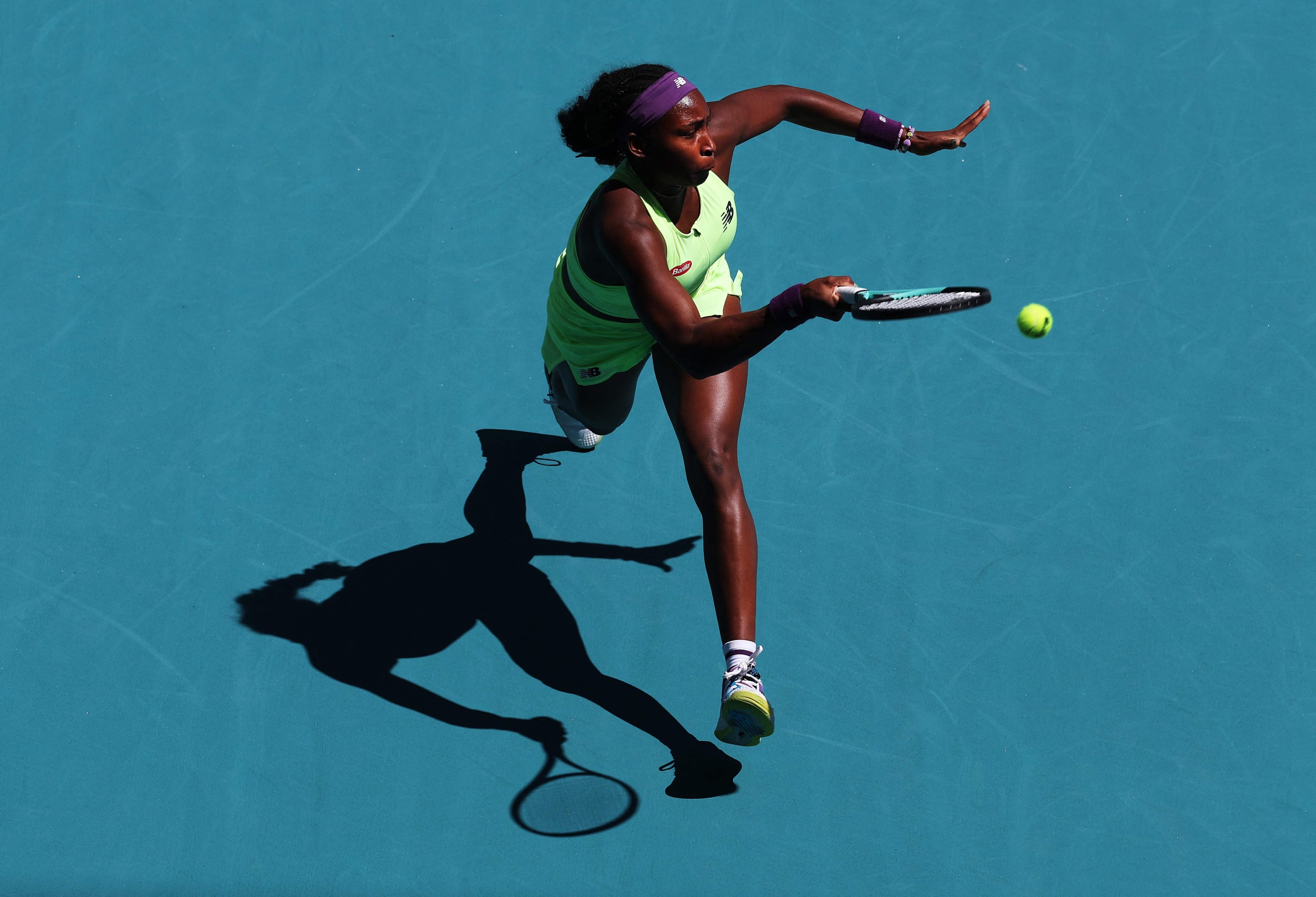 MIAMI GARDENS, FLORIDA - MARCH 24: Coco Gauff returns a shot against Oceane Dodin of France during their match on Day 9 of the Miami Open at Hard Rock Stadium on March 24, 2024 in Miami Gardens, Florida.   Al Bello/Getty Images/AFP (Photo by AL BELLO / GETTY IMAGES NORTH AMERICA / Getty Images via AFP)