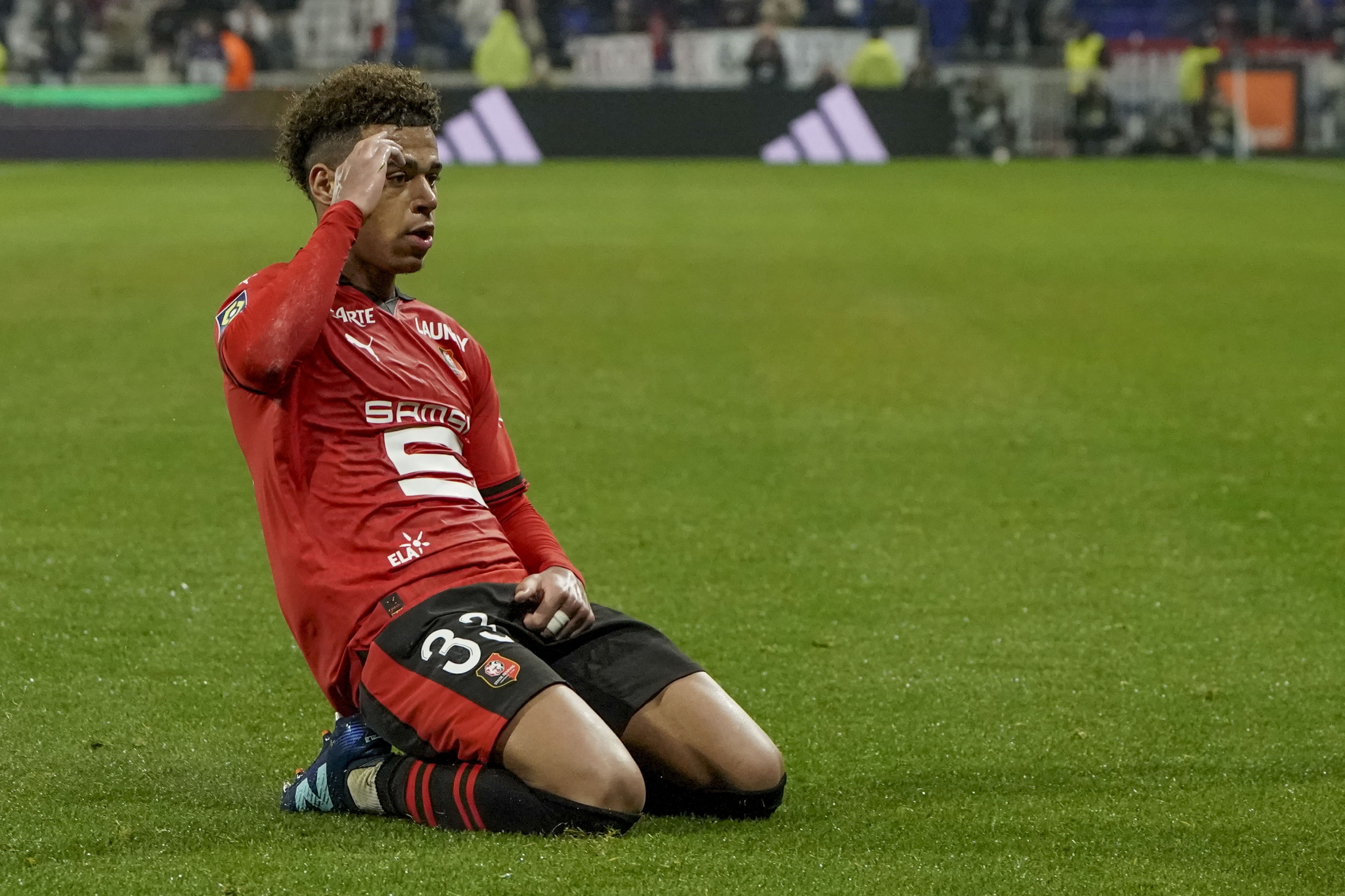 Rennes' Desire Doue celebrates after scoring his side's second goal during the French League One soccer match between Lyon and Rennes at the Groupama stadium, outside Lyon, France, Friday, Jan. 26, 2024. (AP Photo/Laurent Cipriani)