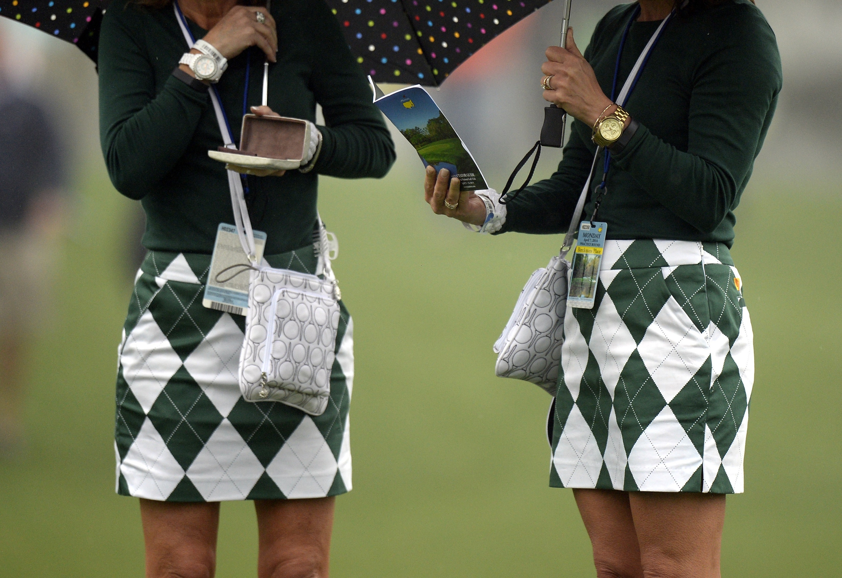 Golf fans in matching outfits watch a practice round April 7, 2014 at Augusta National Golf Club in Augusta, Georgia ahead of the start of the 2014 Masters Golf Tournament.    AFP PHOTO / Timothy A. CLARY        (Photo credit should read TIMOTHY A. CLARY/AFP via Getty Images)