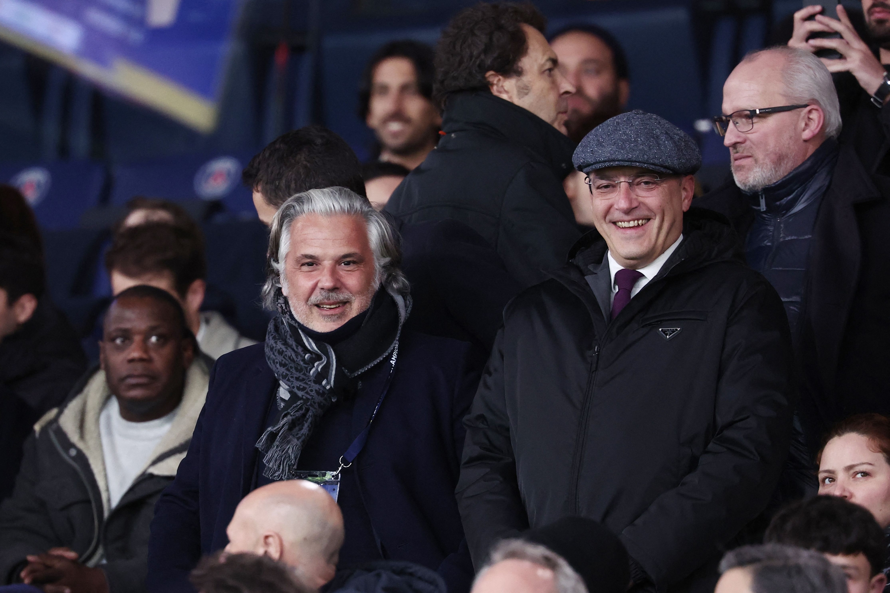 French Football Ligue (LFP) President Vincent Labrune (C) and  President of Toulouse football club Damien Comolli (R)  attends the French Champions' Trophy (Trophee des Champions) football match between Paris Saint-Germain (PSG) and Toulouse FC at the Parc des Princes stadium in Paris on January 3, 2024. (Photo by FRANCK FIFE / AFP)